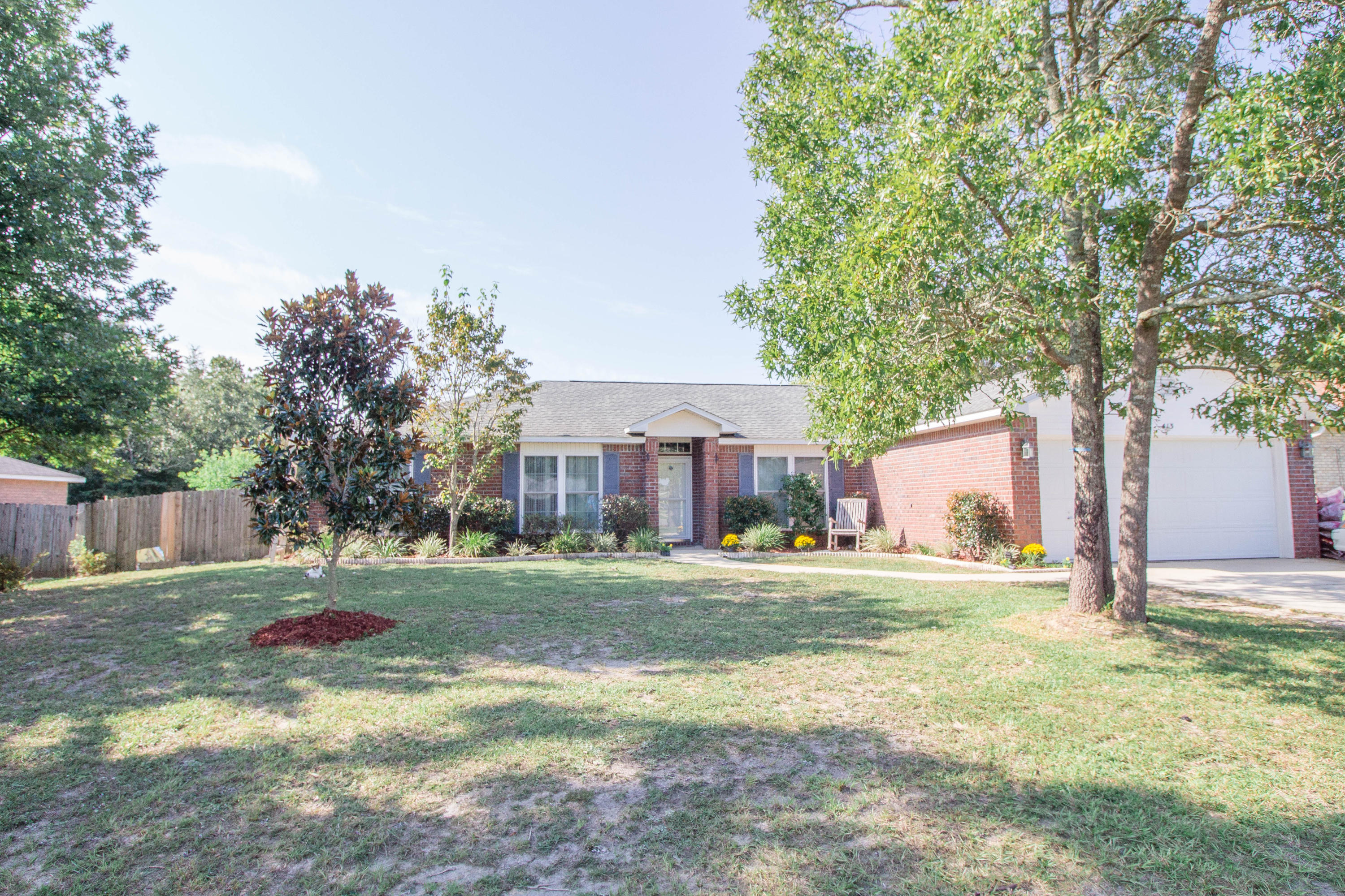 Great 4 bedroom 2 bath home located in south Crestview for a easy drive to the local beaches, shopping centers and local bases. The split floor plan allows for space and privacy and is great for entertaining family and friends. Engineered hard wood floors in the main areas, tile in the wet areas, and carpet in the bedrooms. Kitchen boasts ample granite counter and cabinet space for all your cooking needs to include a center island. There is a formal dining room plus a breakfast room providing you plenty of additional space for whatever your family needs are. The master bedroom is large and master bath has a garden tub, separate walk in shower, dual vanity sinks as well as a walk in closet. Large backyard with a covered and screened in back porch and privacy fencing. There are also two yard