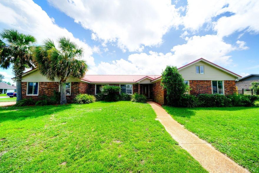 Meticulously remodeled 4 bed, 2.5 bath brick home with a pool located in central Panama City! This home wows with a grand Florida oasis in the backyard that features a refinished in-ground pool and beautiful landscaping. This is the perfect spot to soak up the sunshine with friends and family while being in the privacy of your own backyard. You'll be welcomed home with brand new LVP flooring, fresh paint, and new modern lighting throughout. The open living room and dining area is perfect for hosting guests and is adorned with a modern chandelier. The eat-in kitchen features bountiful cabinet and counter space, stainless appliances, and a breakfast bar. Off the kitchen, there is a sunk in family room that offers a perfect view of your spa-like backyard. This room has vaulted, beamed