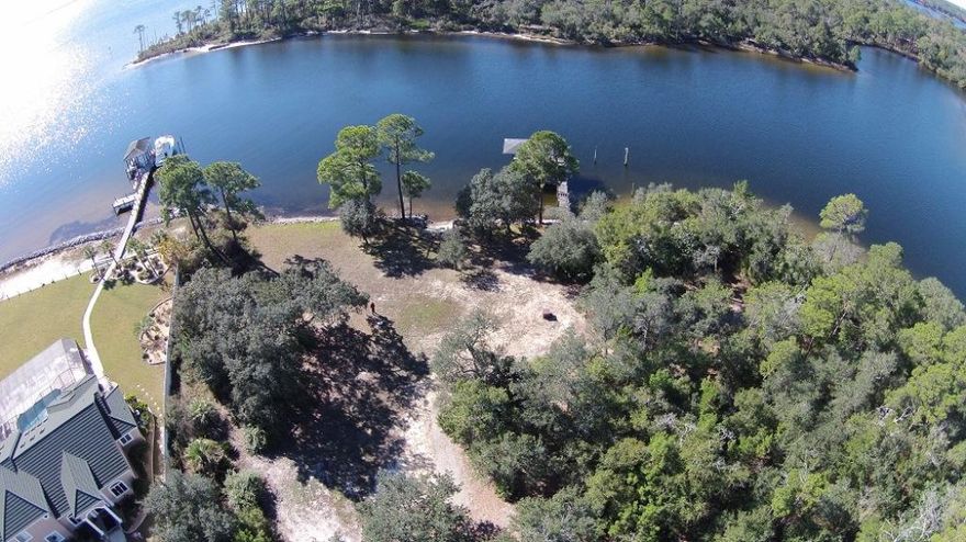 ONE OF A KIND .66 acre lot with 140' of protected DEEP water on Shirks Bayou with views out to Choctawhatchee Bay!! This lot is part of a 1.3 acre lot that is being split. Build your dream home on this partially cleared lot that offers amazing views across the bayou and into the Bay. This property already has a seawall with rip rap, a beach area and a dock (offered in ''as is'' condition). Properties like these simply don't exist anymore so don't miss out! BOTH lots can be purchased as one lot for $799,000.
