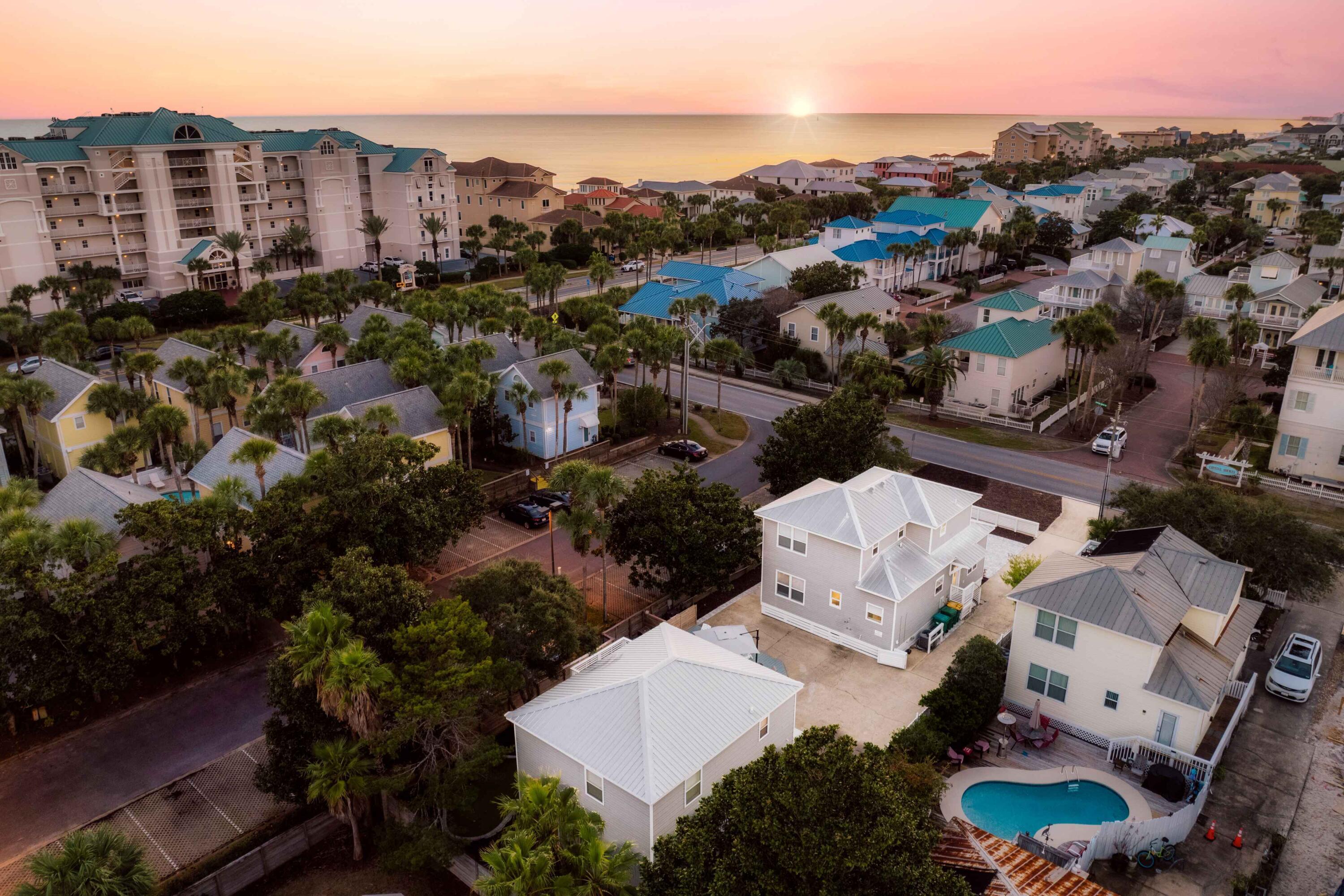 ***SELLER WILL CONSIDER ALL OFFERS!***FANTASTIC OPPORTUNITY TO OWN TWO PROPERTIES ON ONE LOT!HIGHLIGHTS:  * Sleeps up to 16* Parking for up to 8 vehicles* In-ground pool and deck* 1/2 block to the beach* Fully furnished, turnkey, and ready to rent HIGHLIGHTS - MAIN HOUSE:* 3 BR, 3 BA* Open floor plan* High-end Viking appliances* Master and Laundry on first floor* 2 BR upstairs with en suite baths* Wraparound balconyHIGHLIGHTS - CARRIAGE HOUSE:* 3 BR + bunk room and 2 BA * Full kitchen* Dining space for 6 Welcome to your dream escape in Crystal Beach, Destin, a truly sought-after paradise just a "shell's throw" from the stunning Gulf of Mexico. This luxurious main property plus 3+ bedroom carriage house is perfect for those looking to unwind in a coastal haven, offering a perfect blend of comfort and elegance.

As you approach the home, you'll appreciate the convenience of paved, off-street parking for up to eight cars, ensuring that all of your guests feel welcome. The charming front porch invites you to relax with its rocking chairs and swing, creating an ideal spot for morning coffee or evening chats. The wraparound upper balcony offers beautiful views and serene spaces to enjoy the coastal breeze, while the low-maintenance landscaping, featuring a magnificent Magnolia tree, enhances the property's charm.

Step inside to discover a bright, open floor plan that seamlessly connects the living, kitchen, and dining areas. The high-end kitchen is a chef's delight, equipped with top-of-the-line Viking appliances, including a refrigerator, range, dishwasher, and microwave. The quartz countertops provide a terrific workspace, complemented by a well-designed kitchen island and generous storage with stylish cabinets and drawers. Enjoy the inviting atmosphere created by the restful palette and elegant shiplap accents, along with luxury vinyl plank flooring that adds a touch of sophistication.

The primary bedroom, conveniently located on the main floor, offers a king-sized bed and easy access to a full bath in the hall, not to mention a laundry room nearby for added convenience. 

Venture upstairs to find two spacious king bedrooms, each with its own en suite bath. The front en suite features a double vanity, a gorgeous soaking tub, and a separate tiled shower, creating a spa-like retreat. The front bedroom also includes desk space for those who may need to catch up on work while enjoying their vacation. Both bedrooms open to the wraparound balcony, adorned with rocking chairs, where you can savor the sunset views and fresh sea air. The second en suite bathroom upstairs has a tiled shower/tub combination, and ample natural light fills every corner of the space. The home has plenty of storage, including an area for an owner's closet.

The outdoor space is just as inviting, featuring an outdoor shower for rinsing off after a day at the beach, and a small swimming pool surrounded by decking and lounge chairs, perfect for sunbathing, or you can enjoy the shade of the large umbrella. A one-car garage is available, ideal for storing your golf cart, and a double gate provides easy access to the backyard.

For even more options, the carriage house offers additional living space across two stories. Downstairs, you'll find a cozy living and dining area that seats six, along with a well-equipped kitchen featuring stunning granite countertops, a Frigidaire refrigerator, microwave, stove, and a countertop wine fridge, all highlighted by a chic herringbone tiled backsplash. There's also a full bath with a tiled shower for convenience.

Upstairs, the carriage house accommodates up to nine guests with one king bedroom, one queen bedroom, a twin over full bunk bedroom, and an additional twin over twin bunk area in the hallway. A full bathroom with a granite vanity and tiled shower completes this level. A lovely balcony overlooks the pool and deck, providing a perfect spot for relaxation.

This exceptional property combines luxury, comfort, and a prime location, making it an ideal choice for family vacations or a retreat with friends. Embrace the coastal lifestyle and create unforgettable memories in this beautiful haven by the beach.