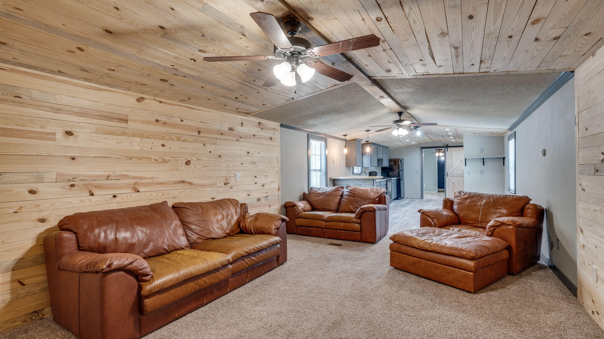 Great mobile home on private lot in the quiet neighborhood of Oakwood Lakes Estates. Complete remodel with new metal roof in 2020, Luxury Vinyl Plank (LVP) flooring in kitchen/dining areas & bedrooms & bathrooms, carpet & track lighting in living room. Natural wood walls and ceilings in kitchen & living room & shiplap in the master bedroom. A barn door leads to the large master bedroom & the master shower is slate tile. New covered front porch. Home is conveniently located to shopping and schools.