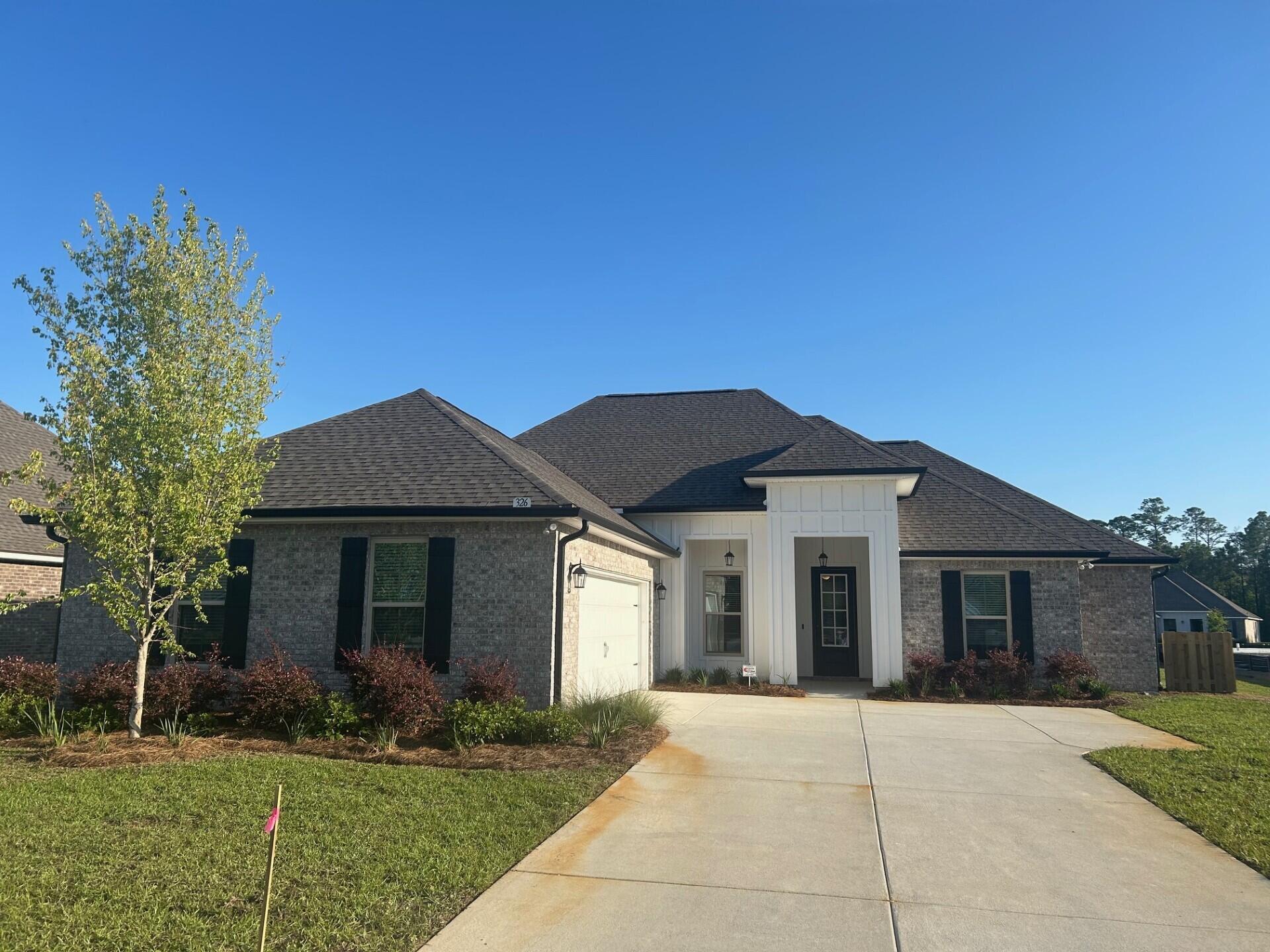 Awesome builder rate plus FREE refrigerator. Restrictions apply.The KLEIN III H in Starburst at Hammock Bay community offers a 4BR, 3BA, open design. Upgrades added (list attached). Features: double vanity, garden tub, separate custom tiled shower, and walk-in closet in master bath, tray ceiling in master bed, kitchen island, walk-in pantry, boot bench in mudroom, covered porches, crown molding, recessed lighting, smart connect Wi-Fi thermostat, smoke/carbon monoxide detectors, landscaping package, architectural 30-year shingles, flood lights, and more!Energy Efficient Features: water heater, kitchen appliance package with electric range, vinyl low E windows, and more! Energy Star Partner.