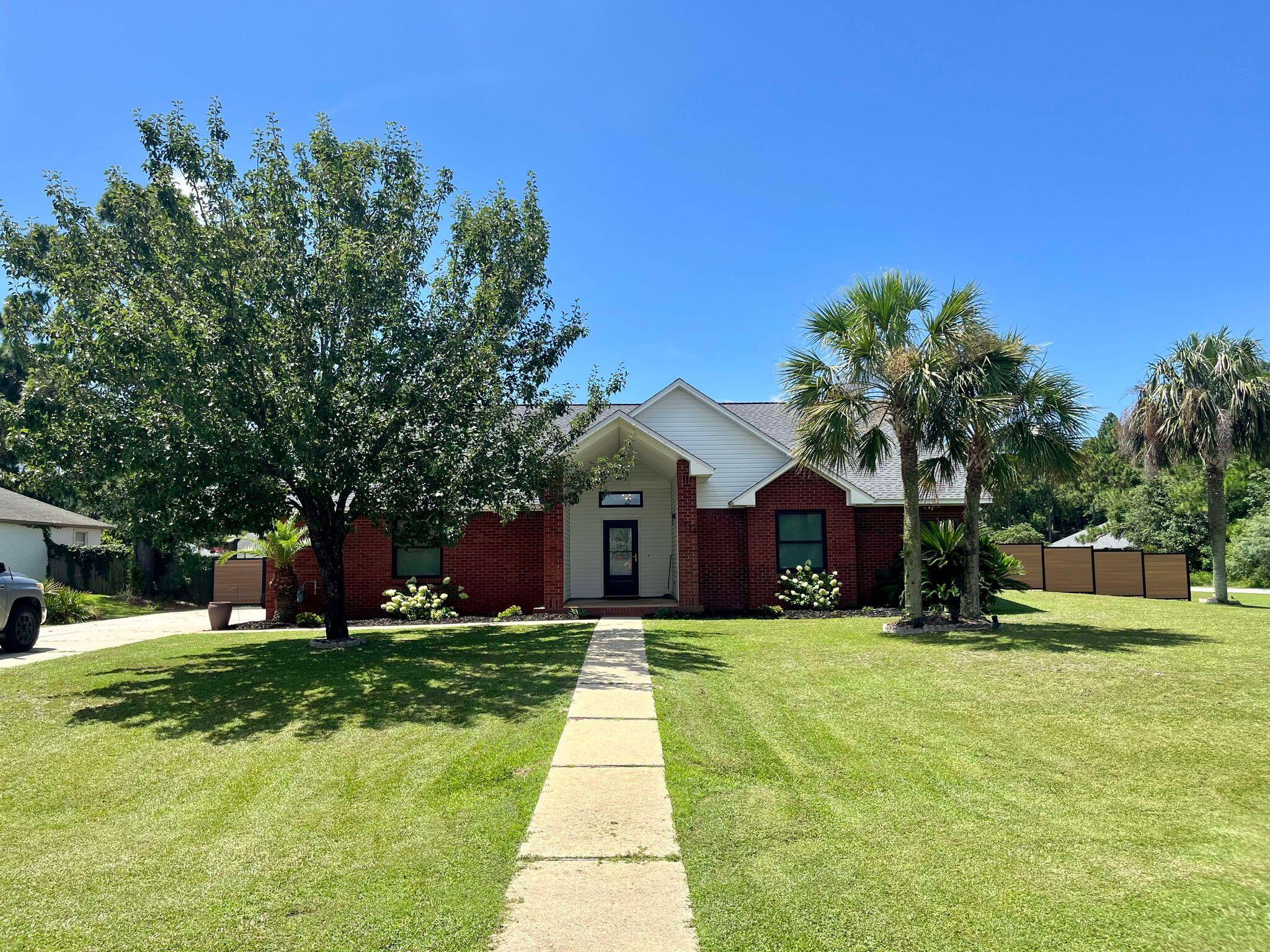 This all brick home is in the Hidden Creek area so there is underground utilities and just minutes from the golf course. It was remodeled in 2016. Has tile throughout. Stone shower in master with large garden tub, Very large walk in closet plus enclosed toilet, custom double vanity. Window seats in most windows giving it more charm. Large fenced yard. This home is available for either a 7 month or 1 year lease. It does come fully furnished, and provides you with all the dishes and cookware you need in the kitchen. Pets available upon approval with a nonrefundable pet fee. Call 850-936-0700 for more information. Keys can be checked out at the office for viewing. Navarre Beach Realty is located in the Winn Dixie Shopping Center, 8666 Navarre Parkway. Office hours are Monday-Friday 9-5.