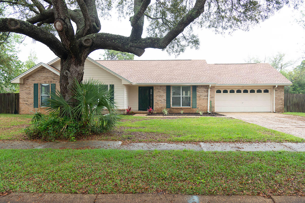 Welcome to this beautifully maintained 3 bedroom, 2 bath single story home. Inside, enjoy a bright, open living space with vaulted ceilings, wood style flooring, and a cozy brick fireplace as the centerpiece. The spacious kitchen features ceramic tile floors, a breakfast nook, and ample natural light from large windows. The split bedroom floor plan offers privacy, and the primary suite features a large walk-in closet and private bath. Sorry no pets allowed. All Coastal Realty Services residents are enrolled in the Resident Benefits Package (RBP) which includes renters insurance, HVAC air filter delivery (for applicable properties) and our best-in-class resident rewards program, and much more! More details upon application.