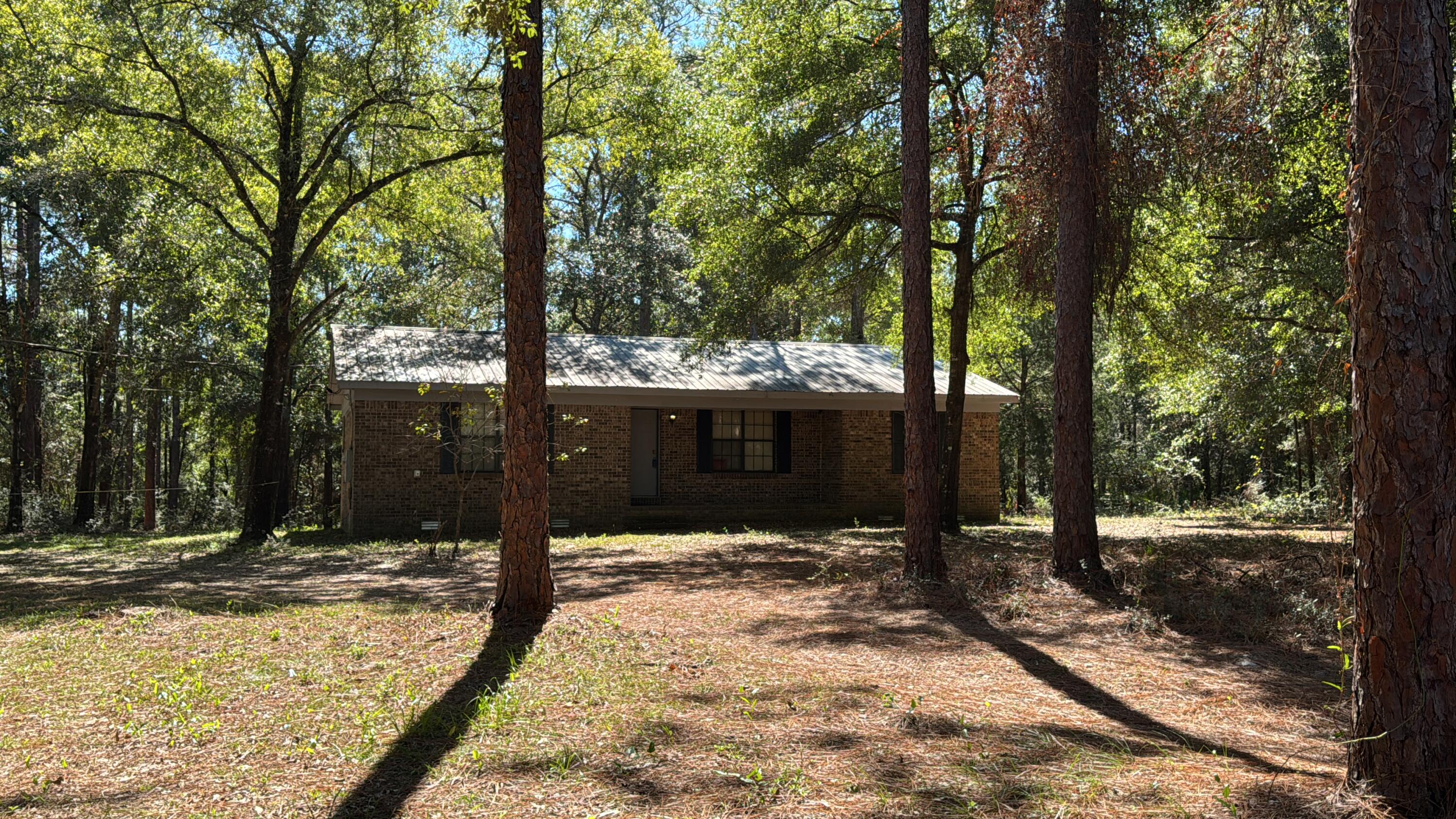 **MOTIVATED SELLER!** Incredible opportunity to own acreage in the heart of Crestview - discover the perfect blend of peace, privacy & potential on this approximately 33-acre property with a 3-bedroom, 2-bath brick home & metal roof. Whether you're dreaming of a quiet homestead, exploring development opportunities, or simply seeking a private retreat surrounded by nature, this property checks every box. Wake up to birds chirping, spot deer down by the little creek, and enjoy your own slice of paradise while staying close to all the conveniences of town - shopping, schools, & restaurants just minutes away. Underbrush has been mostly cleared, making it easy to explore on foot or by UTV. Future Land Use is Low Density Residential - so many options for this versatile property. Incredible opportunity to own acreage in the heart of Crestview!
Discover the perfect blend of peace, privacy, and potential on this approximately 33-acre property with a 3-bedroom, 2-bath brick home with a metal roof, just off Aplin Road. Whether you're dreaming of a quiet homestead, exploring development opportunities, or simply seeking a private retreat surrounded by nature, this property checks every box. Wake up to birds chirping, spot deer down by the little spring, and enjoy your own slice of paradise while staying close to all the conveniences of town - shopping, schools, and restaurants just minutes away. The underbrush has been mostly cleared, making it easy to explore on foot or by UTV. Future Land Use is Low Density Residential - this versatile property offers options right in the middle of Crestview.