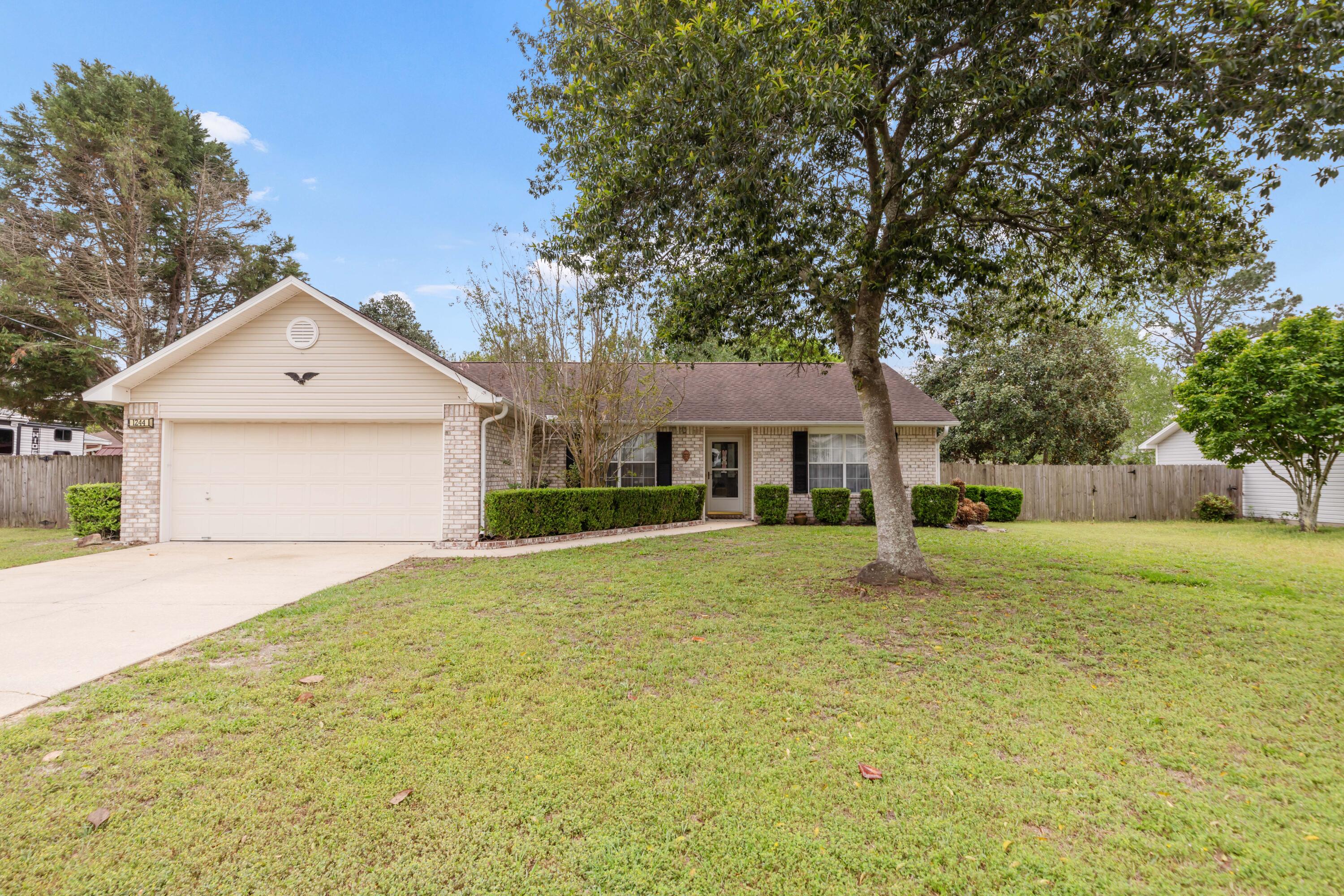 LOCATION, LOCATION, LOCATION! Well maintained Three Bedroom - 2 Bathroom Home with 2 Car Garage on 0.30 Acre Lot in SOUTH CRESTVIEW!!! This open concept and split floor plan offers numerous great spaces to enjoy throughout the home. The spacious living room has new LVP flooring and tall ceilings with sliding glass door access the back yard. The home bas both a formal dining room and a separate dining area, with both rooms near the kitchen. The spacious kitchen has plentiful cabinet and counter top space, complete with an island, breakfast bar, and pantry. The kitchen also offers a French door refrigerator, stove/oven, and dishwasher. Just off of the kitchen is the homes indoor laundry room with access to the 2 car garage with auto opener and pull down stairs. On the opposite side of the home are the two additional bedrooms with ceiling fans and spacious closets. these rooms are separated by a second full bathroom for guests to enjoy. This large 0.30 acre lot has great space in both the front and back yards. The back yard has a 6 ft privacy fence and offers mature flowering trees and bushes, an open patio, and shed. The front yard also has mature trees and shrubs for excellent curb appeal. This home is competitively priced, so don't let your opportunity to own this great property slip away. Schedule a showing today!