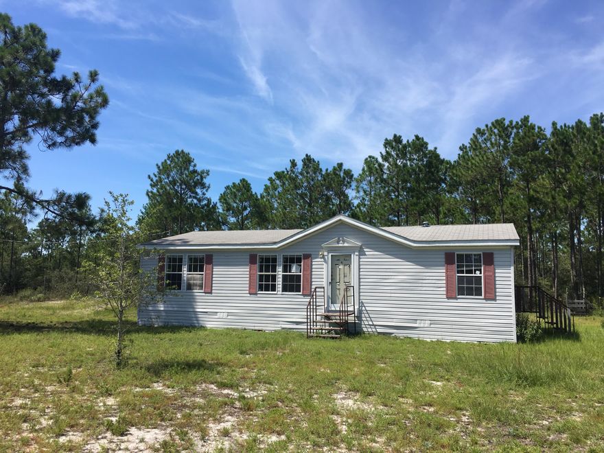 REO  Come see this nice 3 bedroom 2 bath home on a 5 acre lot on a quiet street just outside of Freeport. Large living room, split bedroom plan, and spacious kitchen with dining area. The home is situated back off the road with a fenced yard. Nice large piece of property, so there is plenty of space to make this place your own!! Located just outside of town and only a short drive from shopping, beaches, school, and more. The only thing missing is YOU!!
