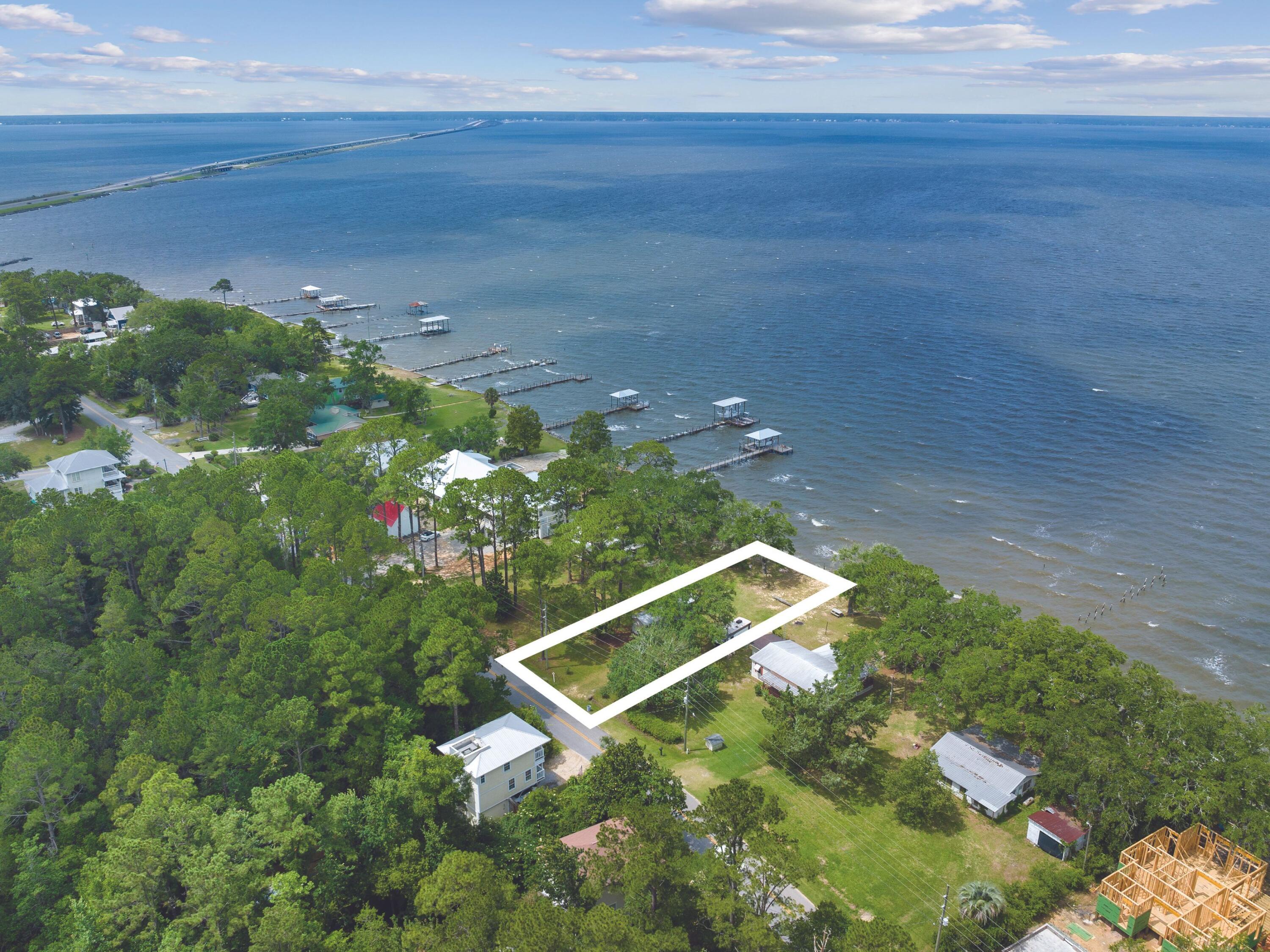 This outstanding waterfront lot in Freeport offers waterfront living with approximately 60 feet of prime water frontage on the Choctawhatchee Bay. It offers privacy and seclusion with open views and access to Choctawhatchee Bay and the Gulf of Mexico beyond. The lot is a prime site for building a dream home. Despite its unspoiled location, the lot is conveniently close to shops, schools, restaurants and amenities, just 10 minutes away.