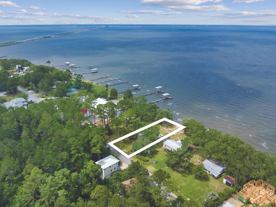 This outstanding waterfront lot in Freeport offers waterfront living with approximately 60 feet of prime water frontage on the Choctawhatchee Bay.  It offers privacy and seclusion with open views and access to Choctawhatchee Bay and the Gulf of Mexico beyond. The lot is a prime site for building a dream home. Despite its unspoiled location, the lot is conveniently close to shops, schools, restaurants and amenities, just 10 minutes away.