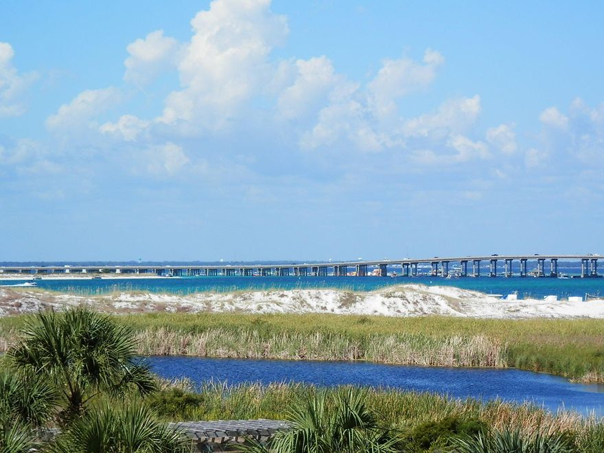 Two Bedroom, 2 Bath unit overlooking the East Pass, Lake Christina and Crab Island. Watch the Thursday night seasonal fireworks, Fishing Boats returning with their catch and beautiful sunsets. The unit has new windows and sliding glass doors. Amenities include a fitness room, heated pool, hot tub, 3500 sq. ft. pavilion w/BBQ grills, tennis courts, shuffle board & 800 feet of pristine white beach right on the Gulf of Mexico. Take a short walk to the jetties for fishing & a cove for snorkeling. Jetty East offers covered parking. The Owners room has been remodeled and can be rented for weddings, guest gatherings and owner functions. Gated community with 24/7 Security. Buyer to confirm any measurements/information they deem important.