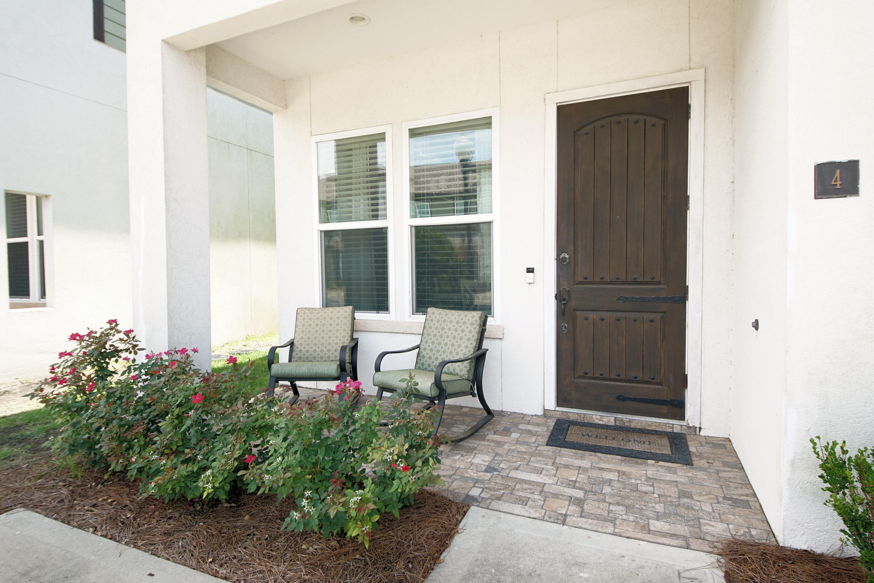 Welcome to luxury living in the heart of Destin! Best price in this gated complex. This Destin Oaks town home is ready for a new family to call it home. Soaring 10ft ceilings, open floor plan, and upgrades galore are just a few of the features that make this a must see. Greeted with tile throughout the downstairs , a chef's dream kitchen with a large island that can easily seat 3 and open to a nice dining area make this perfect for entertaining friends & family. High impact windows and doors, stainless steel appliances, walk in closets in all bedrooms are just a few more of the extra features this home has. The large master bedroom is located on the first floor with an ensuite bathroom, 2 large closets and a large walk in shower. The french doors in the master lead out to a private patio. Upstairs you have a large family / game room with the other 2 bedrooms. The bedrooms have a jack-and- jill bathroom with double vanities and a separate tub/shower room. Downstairs their is a third full bathroom as well. Upstairs off the great room you have a nice screened in patio that overlooks the pool area, perfect for that afternoon glass of wine without the worry of bugs! Enjoy the community pool and clubhouse that are just steps away from your front door. Centrally located in Destin don't miss this fabulous home today.