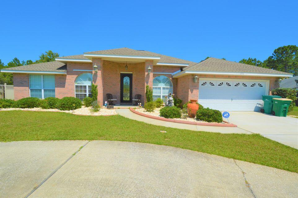 Well Maintained 4 bedroom 3 bath home located in Holley by the Sea. This house features a formal dining room, eat-in kitchen, office/den, and additional bonus room, and a split floor plan. The living room is large and features an electric fireplace. The kitchen features granite counter tops with an island, hop-up bar, walk-in pantry, and a large eat-in kitchen area. The laundry room is very roomy and has a lot of cabinet space. The exterior features a paver stone patio with a pergola and large fenced back yard. Contact Navarre Beach Realty at 850-936-0700. Ready to view Sept 4th and will be ready for occupancy on Sept 5th. Our office is located in the office in the Winn Dixie Shopping Center. Office hours are Monday through Friday 9am-5pm. No weekend showings.
