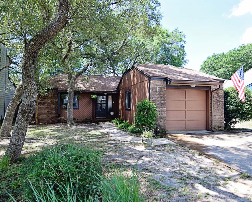 Lovely bungalow-style, 2bed/2bath home with tile and hardwood floors throughout. Kitchen equipped with brand new gas stove and breakfast bar that opens up onto comfortable living room with fireplace, vaulted ceilngs, and sliding glass doors that lead onto patio with privacy fence surround. Master bedroom w/ walk-in closet and ensuite bathroom. Along with the additional bedroom and bath, this home offers comfortable living space without the extra maintenance. Located near schools, college, hospital, shopping, and Eglin AFB. Call today and schedule to see!!