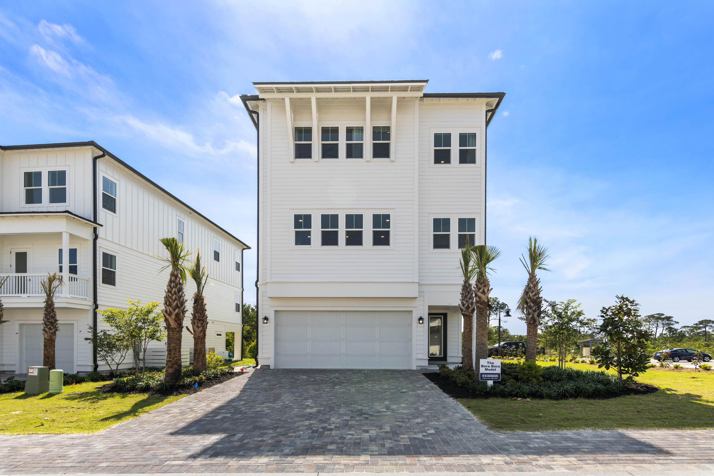 Bluewater Landing is the embodiment of 30A's laid-back and luxurious lifestyle. This intimate 31 home community has easy access to pristine beaches, clear waters, first class dining, and shopping. | Discover 'Bora Bora' at Bluewater Landing: a luxurious 3 bed, 3.5 bath home with 3,408 sq ft. Entertain in style with a spacious 2nd-floor living area, gourmet KitchenAid kitchen, flex space, 2-car garage, elevator, and hardwood floors. Enjoy stunning sunsets and beach access in Blue Mountain Beach.