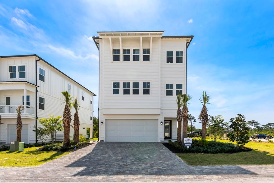 Bluewater Landing is the embodiment of 30A's laid-back and luxurious lifestyle. This intimate 31 home community has easy access to pristine beaches, clear waters, first class dining, and shopping. | Discover 'Bora Bora' at Bluewater Landing: a luxurious 3 bed, 3.5 bath home with 3,408 sq ft. Entertain in style with a spacious 2nd-floor living area, gourmet KitchenAid kitchen, flex space, 2-car garage, elevator, and hardwood floors. Enjoy stunning sunsets and beach access in Blue Mountain Beach.