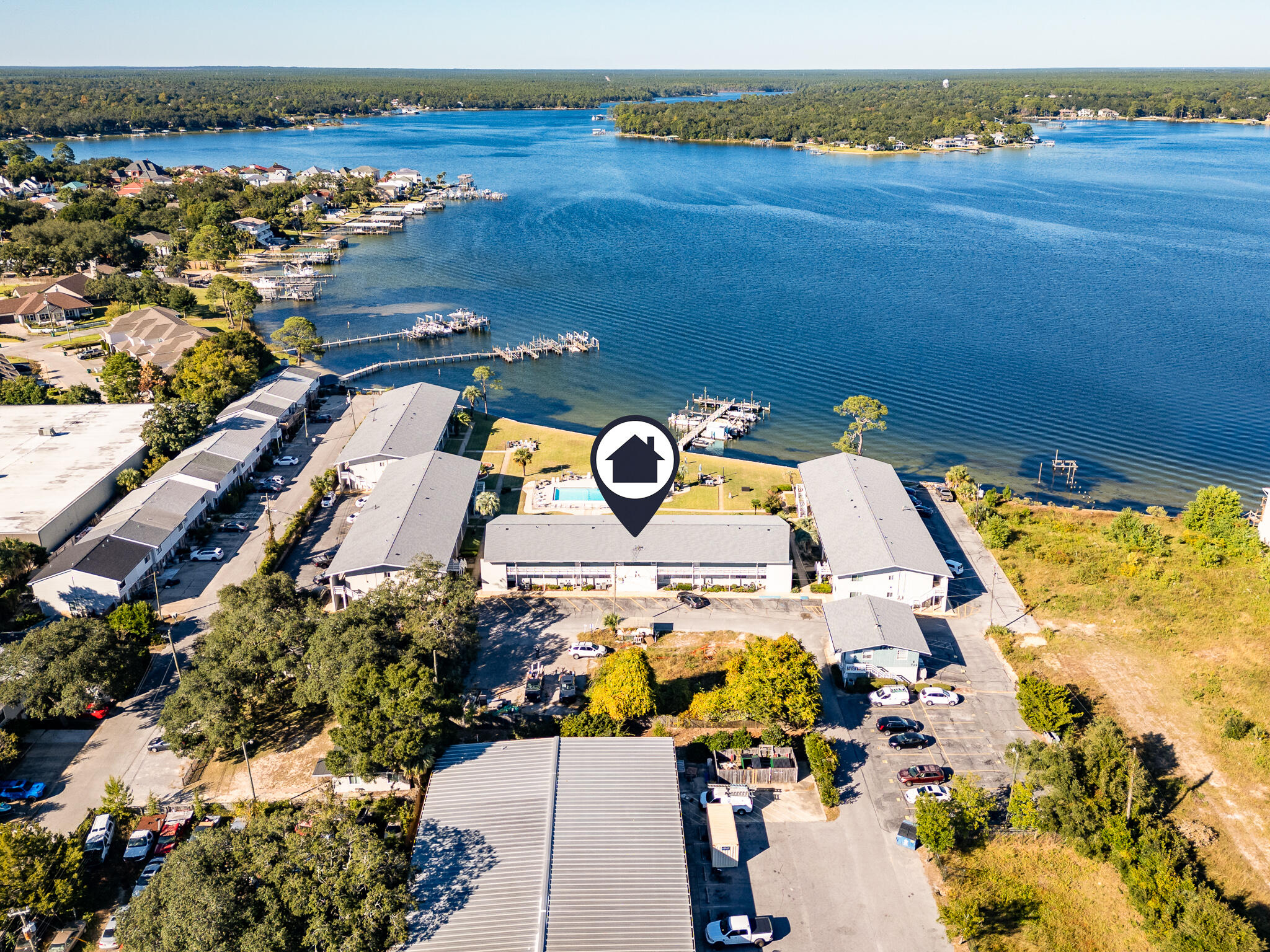 Welcome to your slice of paradise! This stunning waterfront second-floor end condo offers breathtaking views of Poquito Bayou from multiple vantage points, including the kitchen, living room, and master bedroom. Imagine waking up to serene water views every morning! This home has been remodeled with modern finishes, ensuring it's not just beautiful but also move-in ready. You'll love the open layout that maximizes natural light and creates an inviting atmosphere for both relaxation and entertaining. Step outside and enjoy the community's amenities--take a refreshing dip in the sparkling pool, or spend a lazy afternoon swimming from the dock. If you're a boating enthusiast, you'll appreciate the availability of boat slips on a first-come, first-served basis, giving  you easy access to the water whenever the mood strikes. Conveniently located equidistant from Eglin Air Force Base and Hurlburt Field, this community is perfect for military personnel and civilians alike. Please note, this property has a no short-term rental policy, ensuring a peaceful and cohesive neighborhood experience.

Don't forget your bathing suit and sunscreenyour dream lifestyle awaits!