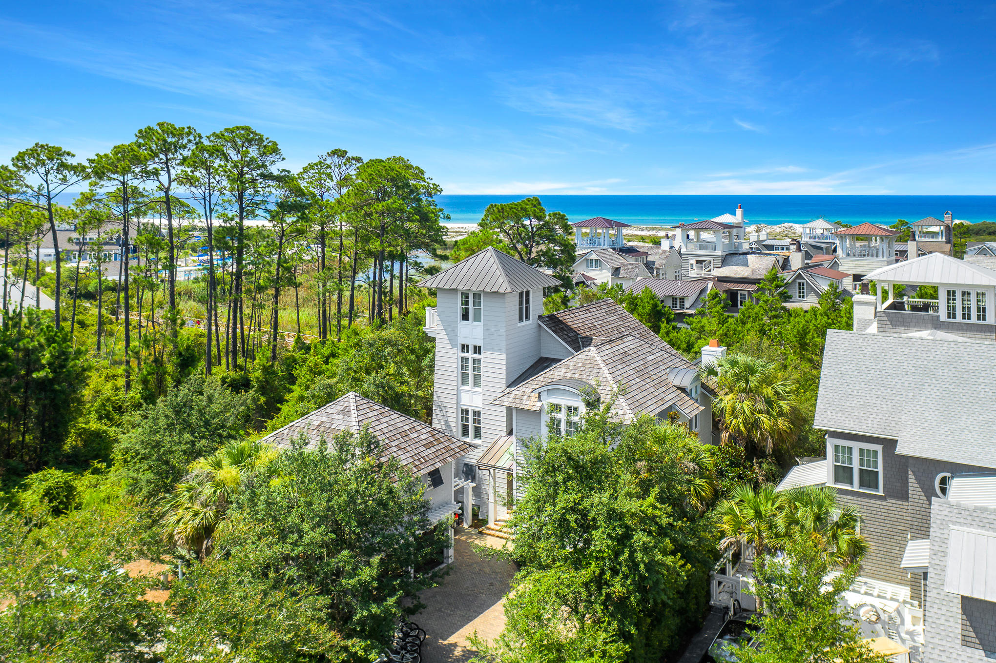 Nestled within Watersound Beach, this refined home offers a highly desirable combination of Gulf Views, Proximity to Pristine Beach Access and the Relaxed Lifestyle of the Watersound Beach Club. Seller will pay membership fee for an all-inclusive, unlimited golf and beach club membership to the Watersound Club.In the classic Nantucket style Watersound is renowned for, this classic home designed by Tom Christ Architects has been appointed with luxury furnishings, custom lighting, home automation and elegant finishes. The double height raftered family room adds to the sense of light and openness. The first floor provides a fabulous kitchen with pecky cypress detail, separate media room with bar and a fabulous owner's suite.