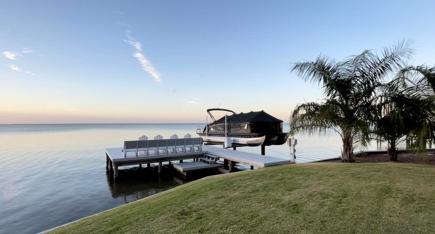 Under contract with a 72 Hour Kick Out Clause In Place. New roof,  HVAC,  water heater,  dock, and boat lift.  The only bayfront home listed in Sandestin outside Burnt Pine.  Bayfront!  Stepping into this home, the peace and serenity granted by the vast views from nearly every room will pull you in.  Recently updated throughout, the open floorplan and high ceilings breathe relaxation. The kitchen offers plenty of counter space for prepping and entertaining, a large pantry and dining space.  The master suite is complete with a large walk-in closet, double-vanity, modern soaking tub, and separate shower. The second bedroom downstairs is a kids' haven with double bunkbeds and trendy accessories. Bedrooms three and four are upstairs, both offering expansive Bay views.