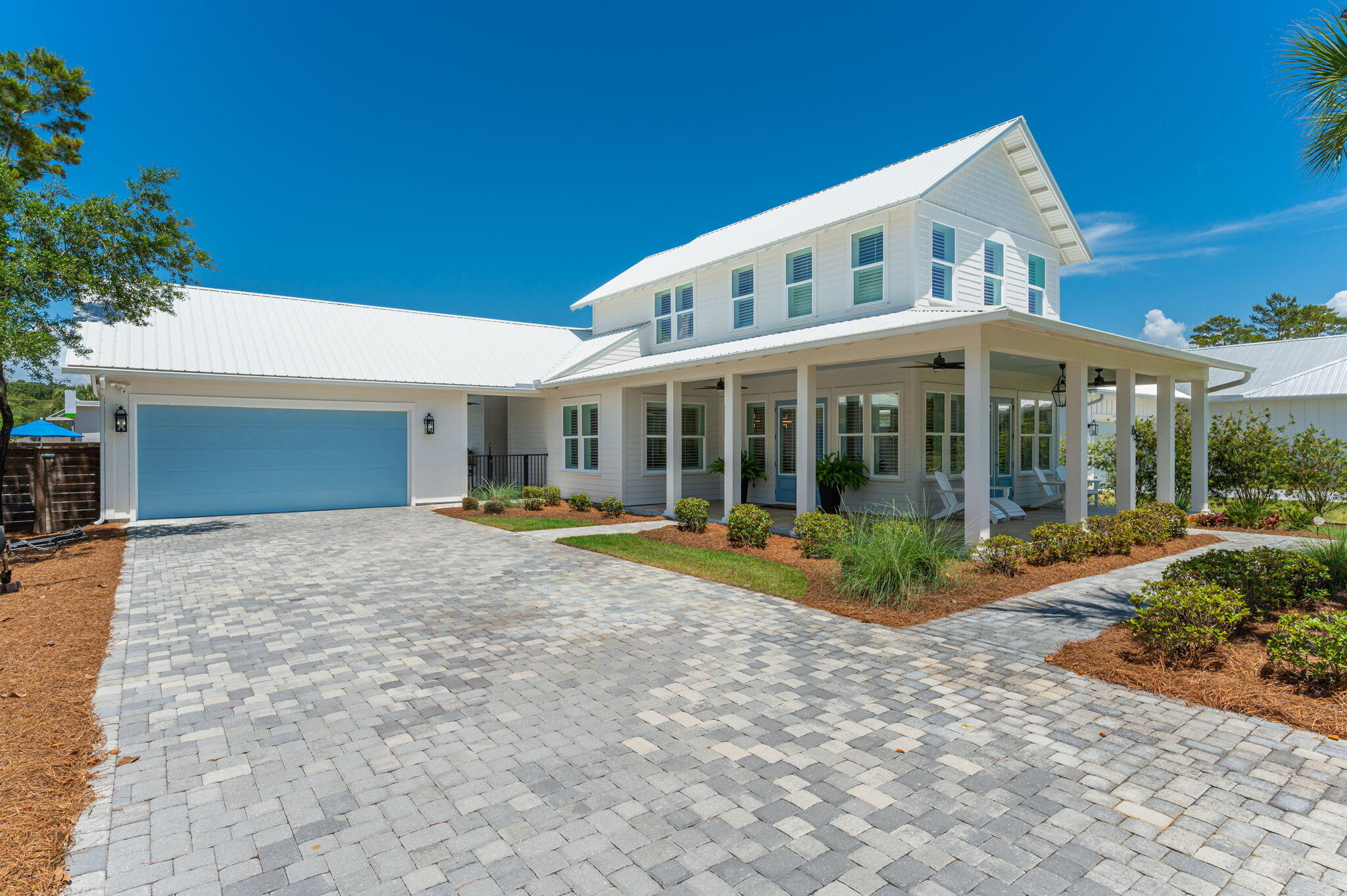 An interior designer's personal home with private beach access in the exclusive Gulf Pines community. This stunning Florida Cottage-style home offers four en suite bedrooms with spa-inspired baths and custom walk-in closets. High-end finishes include wide-plank tile flooring, a striking quartz kitchen backsplash, plantation shutters throughout, upgraded cabinet hardware, and grand illuminated mirrors in the primary and powder baths. An expansive wrap-around porch, private backyard with inground pool, and oversized two-car garage complete this exceptional coastal retreat. Short term rentals allowed although this has never been used as a rental. Driveway space is big enough for 8 to 10 vehicles which is a rare find!