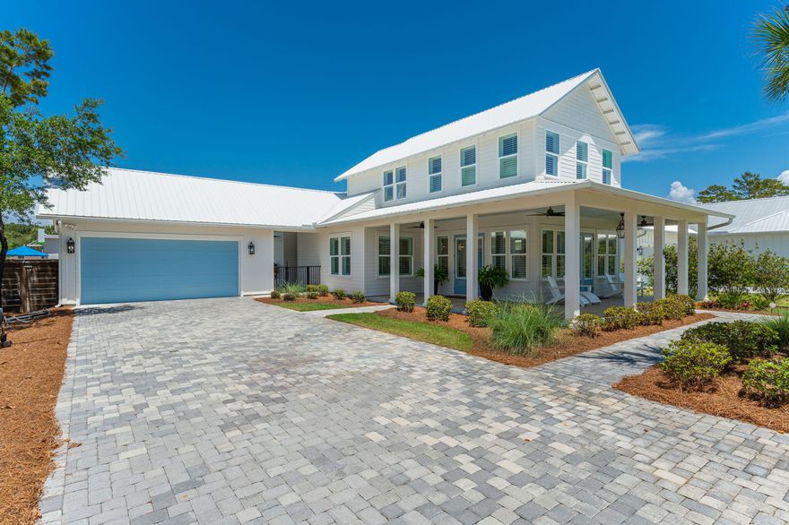 An interior designer's personal home with private beach access in the exclusive Gulf Pines community. This stunning Florida Cottage-style home offers four en suite bedrooms with spa-inspired baths and custom walk-in closets. High-end finishes include wide-plank tile flooring, a striking quartz kitchen backsplash, plantation shutters throughout, upgraded cabinet hardware, and grand illuminated mirrors in the primary and powder baths. An expansive wrap-around porch, private backyard with  inground pool, and oversized two-car garage complete this exceptional coastal retreat. Short term rentals allowed although this has never been used as a rental. Driveway space is big enough for 8 to 10 vehicles which is a rare find!