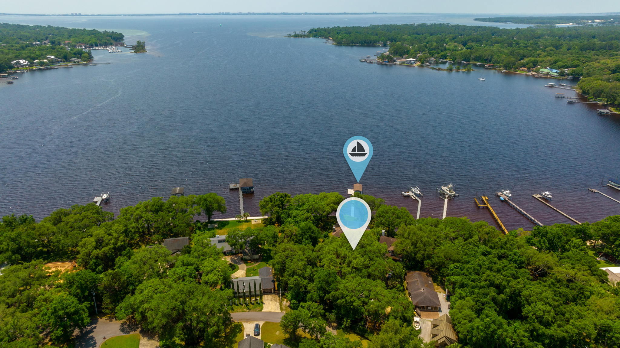 SELLER SAYS THIS IS THE ONLY WATERFRONT HOME IN THIS AREA ZONED--FLOOD ZONE X! Now that I have your attention.. let's talk about this million-dollar view. This property offers PANORAMIC VIEWS OF ROCKY BAYOU AND CHOCTAWHATCHEE BAY. It also comes with a boat dock/boat lift equipped to handle large heavy watercraft! Now let's talk ''homes''. That's right.. plural! This property not only offers a 2-story custom contemporary craftsman, there's a detached 2-story guest house on site! Guest house features an upstairs 1 BR/1 Bath apartment, with a small studio space and 2-car garage below. The main house was inspired by contemporary craftsman waterfront design.. with old-world architectural leanings incorporated. BONUS: BRAND NEW ROOF COMING SOON! Step inside to vaulted wood ceilings.. (continued)