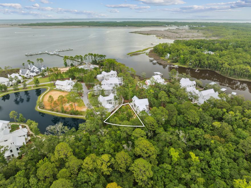 Discover the ultimate coastal lifestyle with Lot 84, a serene homesite privately positioned at the rear of the prestigious Churchill Oaks community. Enveloped by native greenery and overlooking the calm waters of Hogtown Bayou, this lot offers a peaceful canvas to design your dream home. Behind the stately gated entrance, Churchill Oaks blends timeless southern architecture with modern comforts and unmatched amenities. Residents enjoy a newly completed deep-water marina with 36 private boat slips, paddle board storage, and a fish cleaning station. The clubhouse serves as the heart of the community, featuring a resort-style pool, a state-of-the-art gym, and scenic walking trails that meander through the lush landscape. Embrace an active and vibrant lifestyle where nature, elegance, and community convergeLot 84 invites you to make it your own.

