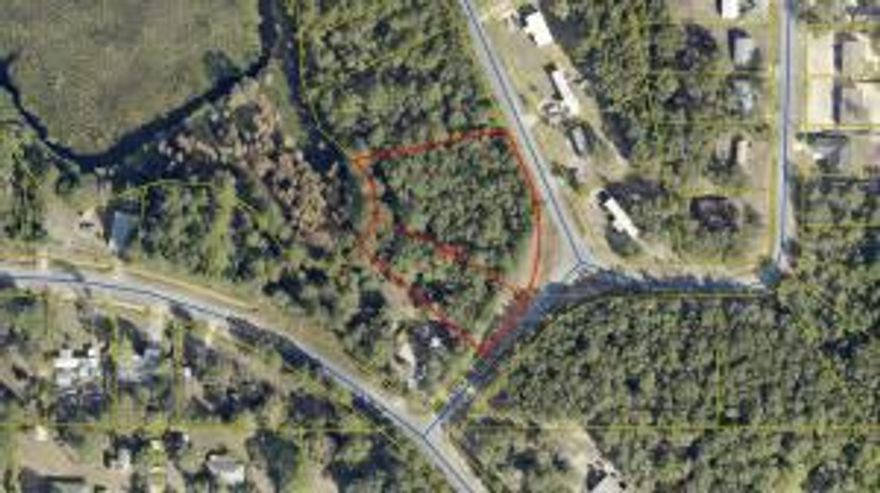 BEAUTIFULLY WOODED LAKEFRONT LOT NEAR DEFUNIAK SPRINGS.  Enjoy 50 feet of lake frontage on a quiet BASS fishing lake.  Tucked away in a peaceful private setting yet minutes from the charm and convenience of DeFuniak Springs.  This  Lakefront lot offers the perfect blend of seclusion and accessibility. Ideal setting for nature lovers, and anyone dreaming of a tranquil retreat. Survey is available and once this parcel is sold it will receive its own legal description The natural tree canopy provides privacy and a picturesque setting for a future home or weekend getaway.  Adjacent lots 36 & 37 are also available, offering a rare opportunity to expand your lakefront footprint.  You can build now or hold for the future.