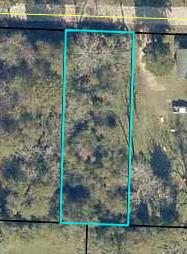 There's no place like HOME in a small town like Laurel Hill. Build to suit a cozy cottage ~ the one you've always dreamed of ~ nestled on a nice sized level block in a desirably tranquil location. This vacant lot retains the value of peaceful living while being conveniently close to a favorite dining at the Laurel Hill Grill, or walk to a nearby school. Priced to sell! Check with Okaloosa County Planning and Permit and the City of Laurel Hill for any questions or clarification of acceptable building permits. Buyer to perform due diligence - all measurements to be verified by the buyer.