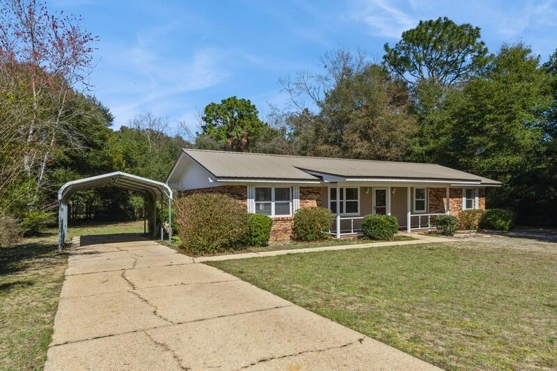 This brick, ranch-style home is conveniently located in central Crestview on almost a 1/2 acre FLAT Lot. The entire interior has a fresh coat of paint and recently cleaned carpets. The galley kitchen has quality cabinets, stainless steel fridge/stove plus a spacious pantry and dining area. Other property features of this 3-bedroom, 1.5 bath home include a 2013 metal roof, 2024 HVAC, 2022 Water Heater, updated double-pane windows, with lower County taxes and on the Auburn Water System. The backyard has many possibilities - add a garden, firepit or above-ground pool! The shed in backyard has ample storage for your yard tools. Home is move-in ready and waiting for it's buyer!