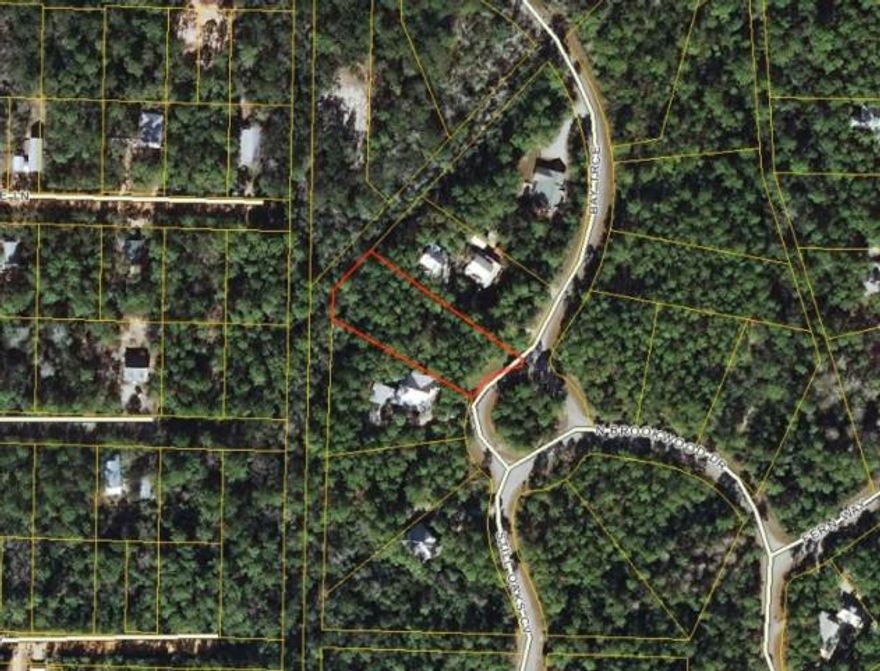 The Woods is a wonderful quiet subdivision with large wooded lots and privacy. New houses are under construction in the subdivision.The Woods has bay frontage with a community park and fishing dock accessible by a walking trail. This property offers an appealing blend ofprivacy and convenience to the beaches. Shopping, groceries, entertainment, recreational activities, schools and hospital/medical care proximate.The community has underground utilities, street lights and a private access road. The Walton County GIS system depicts the lot as primarily notbeing located in a flood zone. This is a beautiful lot worth a look. Basic water tap fee has been paid.