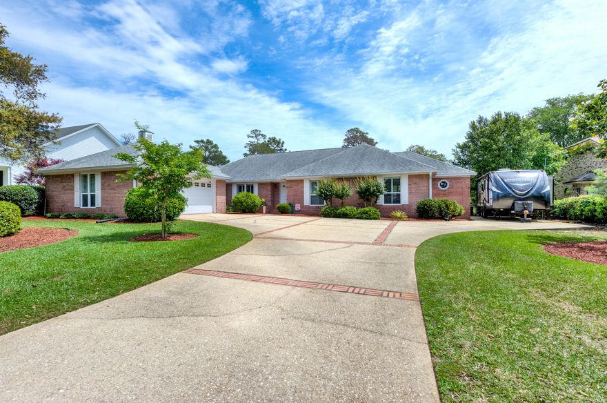 A Must See.... Won't Last Long! Beautifully landscaped and recently renovated home on the 13th fairway of the Shalimar Pointe Golf and Country Club. This 3 bedroom, 2 -1/2 bath executive brick ranch has new ceilings, new interior paint (to include all trim), all new light fixtures, all new toilets, new hardware, new faucets, new HVAC ducting, Levolor solar accordion shades in back, all new windows, new 30 foot concrete rv/boat parking pad and more. This also home offers an open floor plan, high ceilings, trey ceiling in formal dining room, plantation shutters in kitchen, dining room and 2 front bedrooms. There is also an integrated ironing board in laundry room/mudroom and a dedicated garage door for golf carts with a custom brick path directly to the golf course.