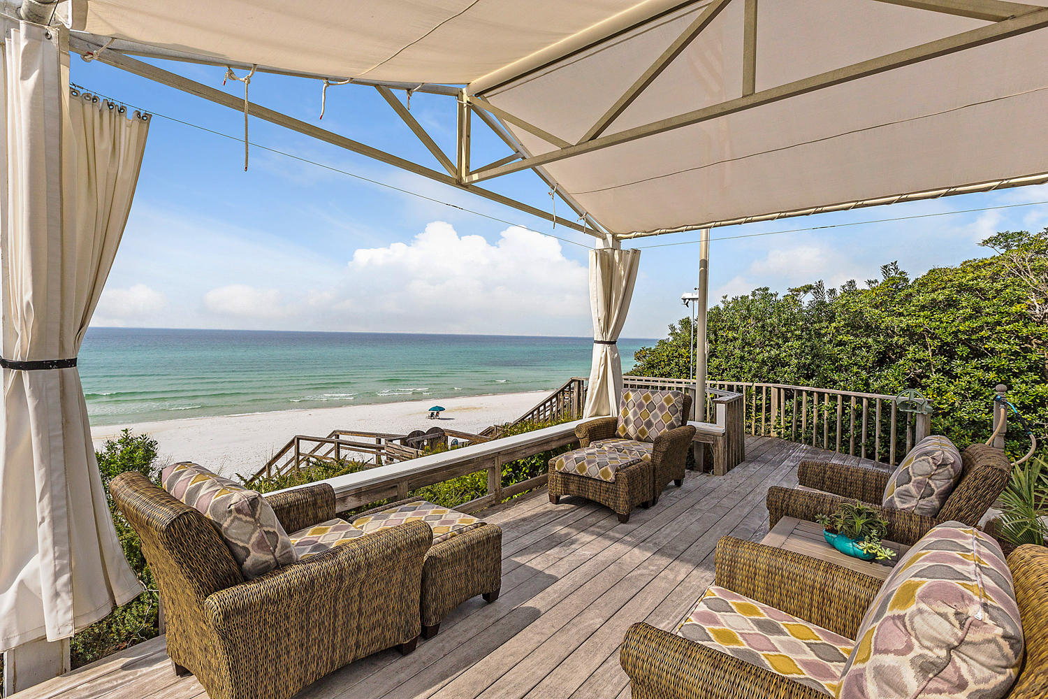 Sophisticated, coastal elements brimming with elegance sets the tone for this striking Seagrove gulf front home thoughtfully designed by Thurber Architects. From the moment of entry, your visual senses are captured by stunning gulf views through dramatic floor to ceiling windows on the beach side main living area. Luxurious finishes and artful details grace this home at every turn and include an elegant two story winding staircase, glass beaded wall, a soothing, sophisticated color palette and interior dcor. Situated at the top of a high beach dune, this one-of-a-kind 4276 sq. ft. residence boasts a generous 60 ft. of gulf-frontage with private direct beach access. Sit fireside in the living room or entertain friends and family in an exquisite dining room or dine alfresco on a