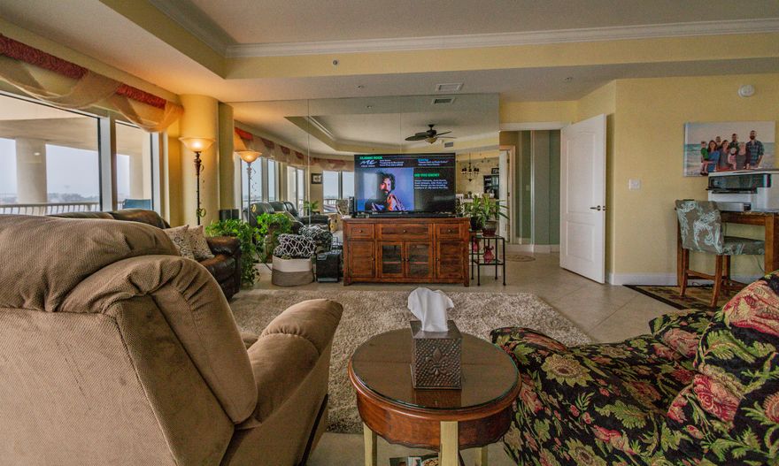 Presidio Yacht Club - A Luxury Waterfront Condominium. This is by far the most popular and usable floor plan in the Presidio. This three bedroom with adjoining three bathrooms is an open and spacious floor plan that has no interior columns as other floor plans do. The living room, dining room, and master bedroom have panoramic views of the sound and are surrounded by balconies, which is great for entertaining. Only this 2300 square foot unit on the 4th floor allows you to enjoy the stunning sunrises and sunsets from the patio and the year-round breathtaking views of the Intercoastal Waterway and Gulf of Mexico. The Gourmet Cook's kitchen offers a new stainless steel refrigerator, dishwasher, microwave and and upgraded granite plus a larger one level Island and countertop with mirrored back