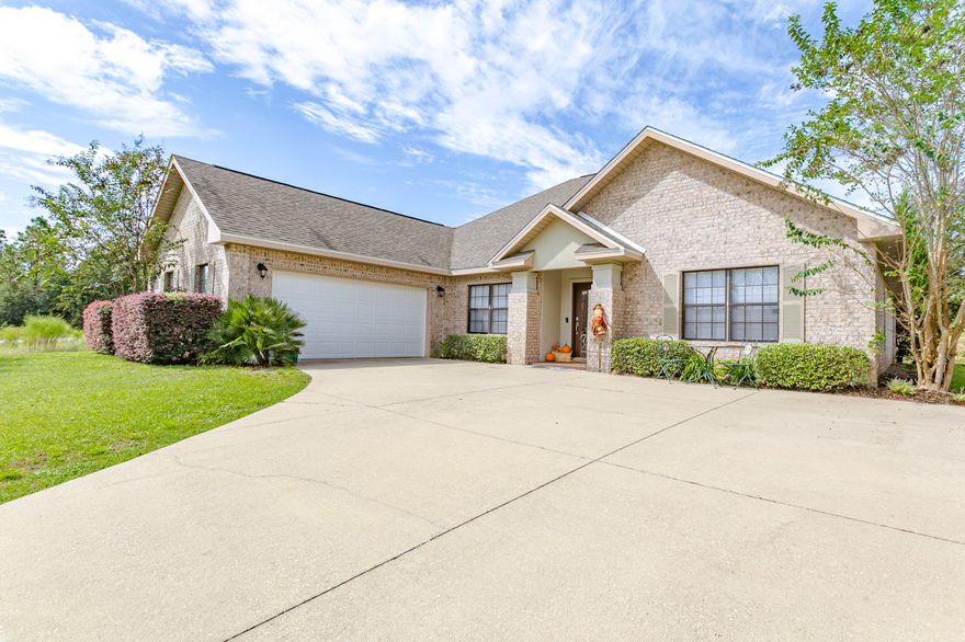 WELCOME HOME!!! You'll immediately notice the stunning engineered hard wood floors through out the home!  The large living room is open to the kitchen, making a perfect area for entertaining friends and family for the remainder of football season and the holidays. Kitchen boasts plenty of granite counter space and cabinetry to meet all your cooking needs. Don't forget the stainless steal appliances. The split floor plan provides privacy and retreat to your master suite. Master bath has dual vanity, separate walk in shower and tub and walk in closest. The other rooms are large and ready to meet your families needs. Covered back porch is great for drinking your morning coffee, as well as ready for your bbq grill! Schedule your showing today!!!