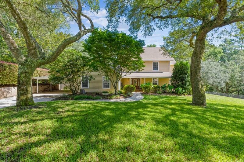 Charming one of a kind 5 Bedroom, 3 bath home with an additional office/flex space! Proudly backing up to a nature preserve with a tranquil and private setting and featuring a beautiful wrap around front porch! Conveniently distanced to Eglin and Hurlburt bases, as well as shops, and the beach! Home is less than one mile from a boat ramp to the bay and only a 5 minute drive to the Mid-Bay bridge! Open floor plan to include a beautiful cedar planked vaulted ceiling in the family room with a wood burning fireplace. Kitchen has large granite island and tons of countertop space, with plenty of cabinets and a double oven for those large family events! A courtyard waits for you to enjoy your morning coffee and screened in porch for the late afternoon BBQ.