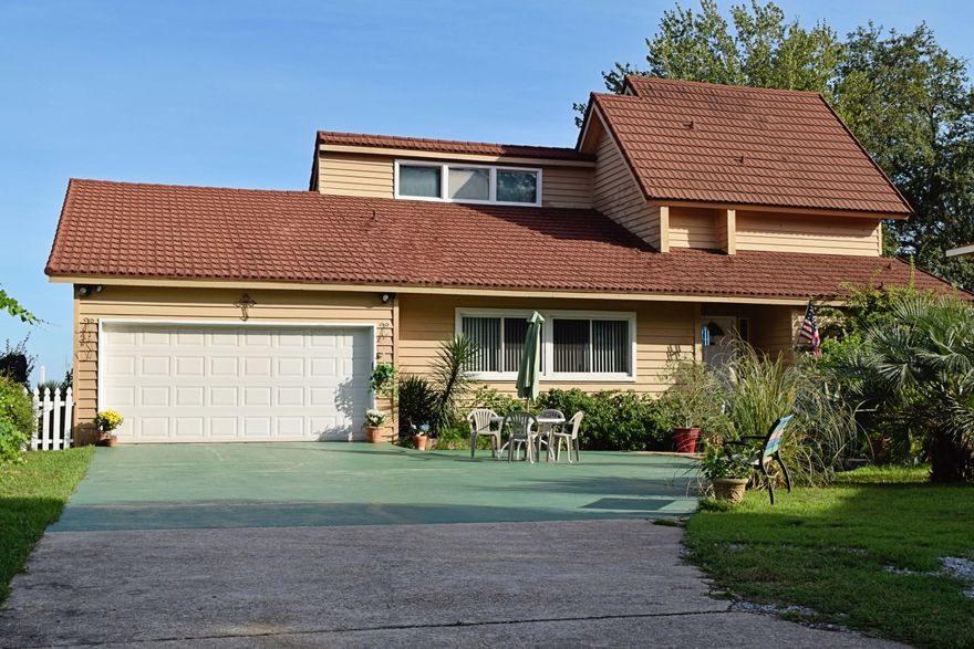 Absolutely beautiful waterfront home on the bay. Gorgeous panoramic views from almost every room in the house. Spacious open floor plan. Kitchen has all appliances, granite counter tops, wet bar, custom cabinets, lazy susans, pull out shelving and pantry. Every level has a bedroom with the master on the main floor. There is a covered balcony and patio; both of which overlook the bay. There is a sea wall, a dock, and a covered 10K lb. boat lift.The dock has water, electricity, and a fish cleaning station. you can see beautiful gulf coast sunrises and sunsets from both decks, the patio and the dock. This is Florida living at its best!