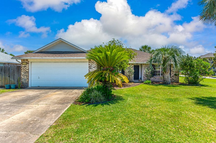Don't miss out on this beautiful Sandy Beach Estates home located on a spacious corner lot. As you enter the home, you are greeted by the open dining area and living room that leads to the florida room in the back of the home. The home features a three bedroom split floor plan with duel vanities in the Master bath. You can also enjoy the outdoors in the fenced-in backyard with open patio and seating area for relaxing and entertaining. Across the street you will find the community park with a dock and small beach area. This is perfect for enjoying the sunset or grabbing your paddle board to enjoy the water.