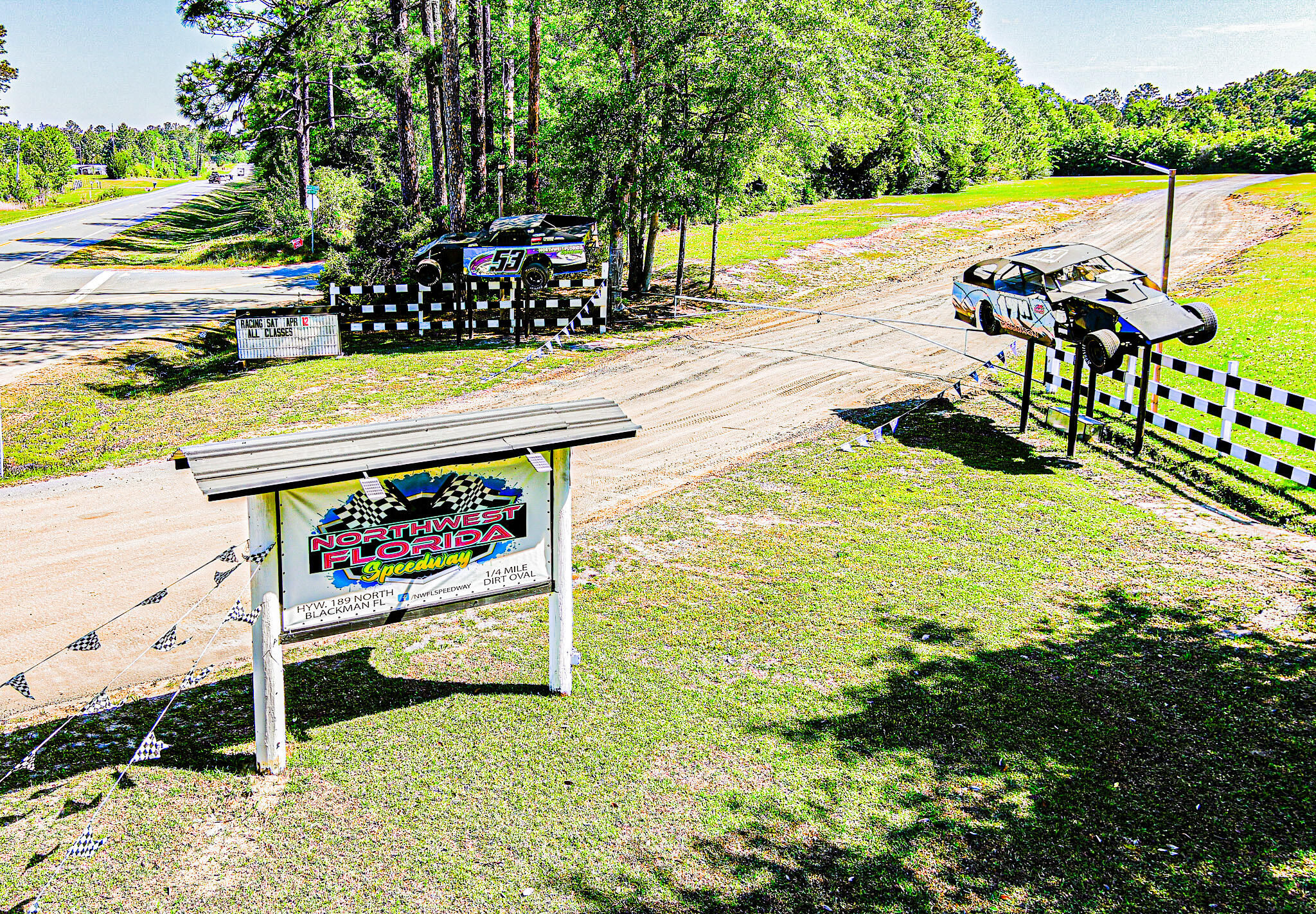 The speedway is 1/4-mile oval dirt track with decades of racing history! The stands have an approximate 700 person seating capacity. This expansive commercial property offers endless development potential--ideal for a truck stop, RV park, or logistics center. Prime location on a high-traffic route to the beaches of 30A and Florida Emerald Coast. Versatile site with great visibility and access. Sold As Is. Don't miss this rare investment opportunity! High traffic area to Crestview, FL and multiple military installations.. Showing by appointment only.