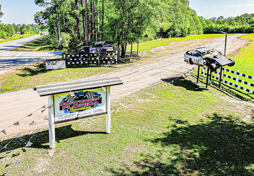 The speedway is 1/4-mile oval dirt track with decades of racing history! The stands have an approximate  700 person seating capacity. This expansive commercial property offers endless development potential--ideal for a truck stop, RV park, or logistics center. Prime location on a high-traffic route to the beaches of 30A and Florida Emerald Coast. Versatile site with great visibility and access. Sold As Is. Don't miss this rare investment opportunity! High traffic area to Crestview, FL  and multiple military installations.. Showing by appointment only.