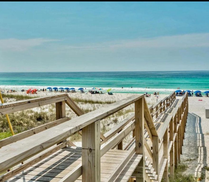 Live the beach life in this RARE FIND along Scenic 98, just a 3-minute walk from your front door to deeded beach access.  Extensive updates completed in 2022 including luxury vinyl plank flooring, 6' base boards, and crown molding throughout; recessed lighting; brick veneer accent walls; plantation shutters; 23 CF Samsung stainless steel refrigerator and whisper-quiet dishwasher; honed marble kitchen backsplash; added storage space beneath stairs; and complete remodel of all bathrooms including new tiling, toilets, sinks, extra large shower with bench and dual shower heads, deep soaking bathtub, vanities, lighting, and fixtures. Entering the property through the jasmine-covered arbor, a gorgeous private courtyard greets you with an outdoor shower and oversized closet,  for all your beach essentials.  Courtyard was expanded, tiled, and re-landscaped in 2022 and is perfect for entertaining friends or serving as your personal mini oasis. 
From the courtyard, enter the home either through the sliding glass doors which fill the kitchen and dining room with natural light, or via the front door into the main living area (which owners have currently repurposed as gym space).  A stylish half bath is also conveniently located on the first floor. 
Upstairs there are two updated large bedrooms with en-suire bathrooms and ample closet space, a laundry room, and private balcony where you can enjoy the sun and sea breeze.  
Beach point is a sought-after community offering two assigned parking spots per unit, a community pool and private beach access just steps away.  With excellent rental potential ($50-60k/year), this property is ideal as a primary residence, vacation home, or investment property. 

What's Special

Deeded beach access
Extensive updates
Private courtyard & balcony
Spacious bedrooms
Fully remodeled bathrooms
Outdoor shower
Ample storage
Beautifully landscaped
Community pool

