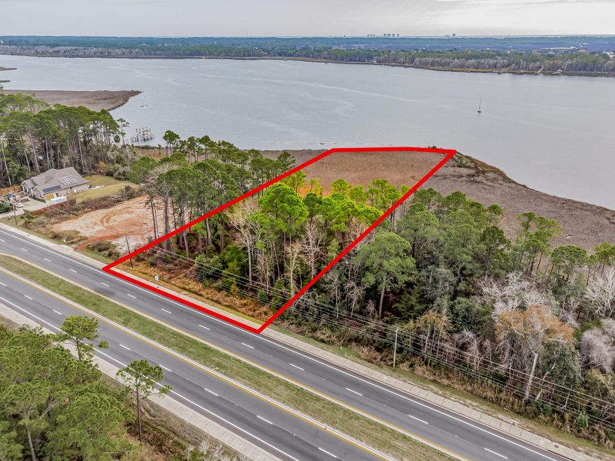 Don't miss your opportunity to acquire 1.42 acres of waterfront land in Navarre, Florida! Located along the picturesque Gulf Coast and showcasing beautiful Bayfront views, this expansive parcel of land offers the perfect canvas to make your vision of coastal living come to life. With approximately a quarter of the land already available for construction, you have ample space to create your dream waterfront retreat while preserving the natural beauty of the surrounding landscape. Imagine designing a stunning custom home, complete with panoramic views of the tranquil waters and endless opportunities for outdoor recreation. Don't miss your chance to own this coveted piece of Navarre's waterfront paradise and embark on a life of luxury and relaxation by the sea.