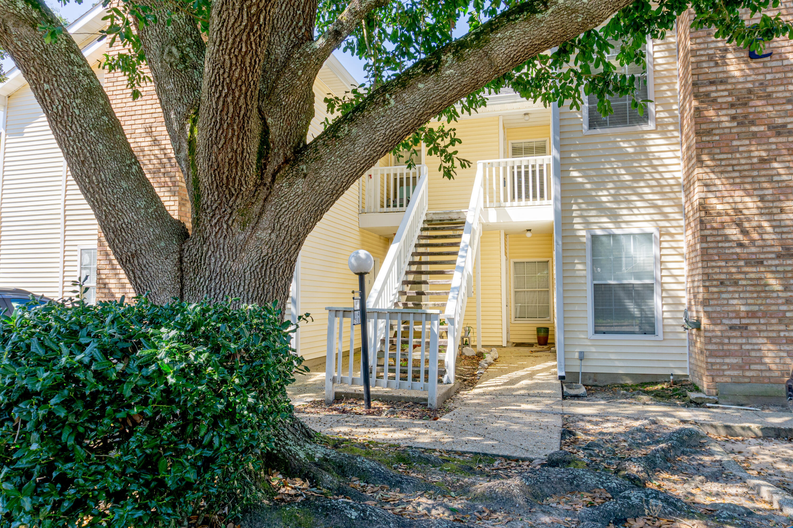 Beautiful 2 bedroom, 2 bath unit in Riverwalk condominiums. Situated at the end of a quiet street. Centrally located in Pensacola this complex is close to Hospitals, UWF, Pensacola State college and Interstate 10, and walking distance to shopping and restaurants. This unit has been updated with, luxury vinyl flooring, granite counter tops, stainless steel appliances, light fixtures and some plumbing fixtures and painted cabinets. Other features include: vaulted ceiling in living room with wood burning fireplace, separate dining area, inside laundry, balcony and outside storage area across from front door. HOA replaced the roof 2021. Sellers replaced HVAC 2016/2017, Hot Water Heater 2024, Appliances 2017. In the summer time enjoy relaxing in the community pool.