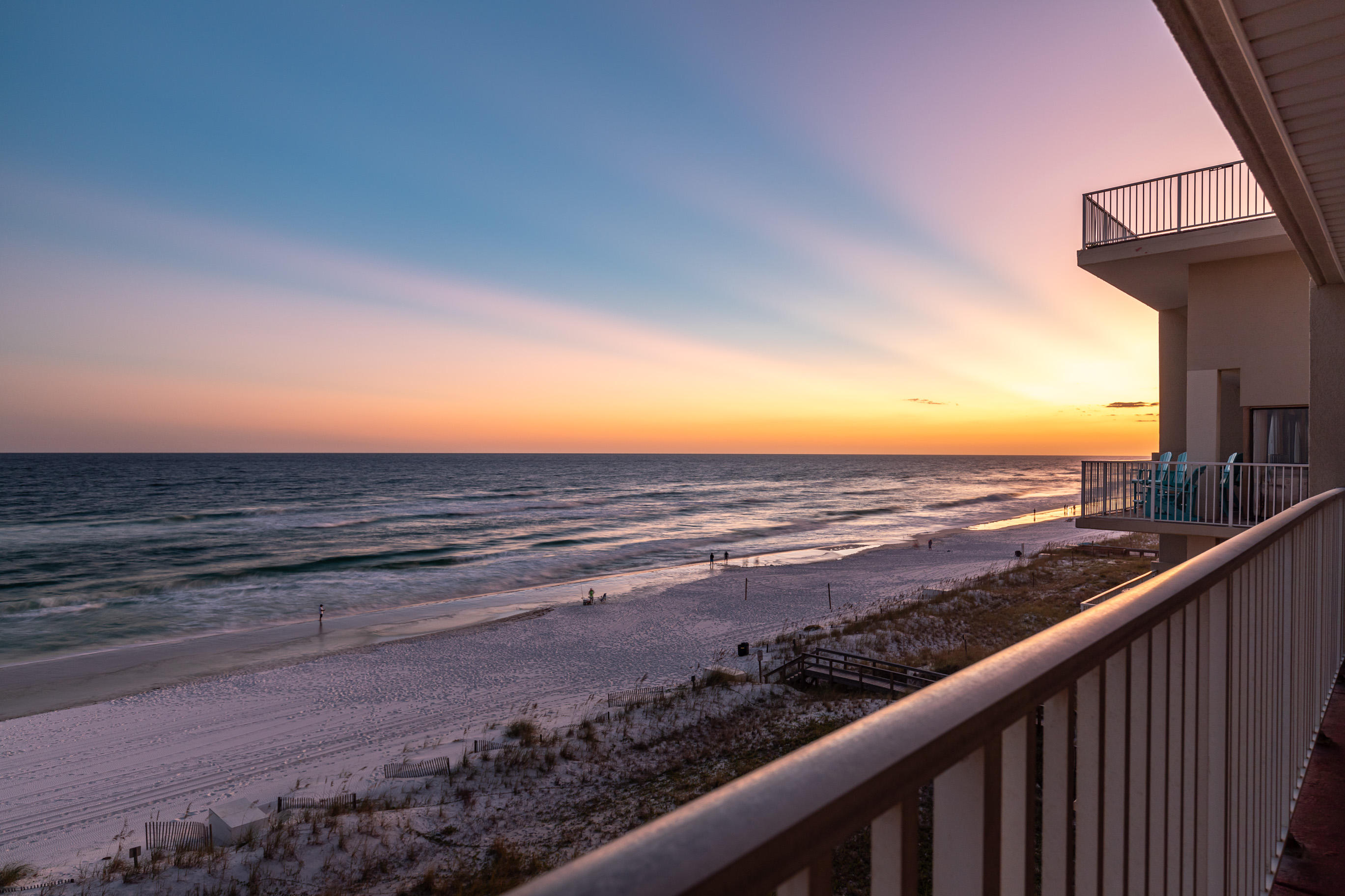 Stunning Gulf front, end unit in low density building with impressive rental history. This 2 bedroom condo boats new tile in main living areas, new light fixtures, granite counter tops, updated bathrooms, and new furniture and electronics. A/C, water heater, and washer/dryer have all been recently replaced. Enjoy spacious bedrooms, plenty of storage, and massive balcony which is accessible from master. Excellent investment opportunity, second home, or primary residence. The Palms Condo only has 23 units in the building and offers great amenities including: pool with brick pavers, grills, game area, beach walk-over with showers and bathrooms. Unit 501 comes with a covered parking spot looking out over the beach. Some utilities covered in HOA dues.