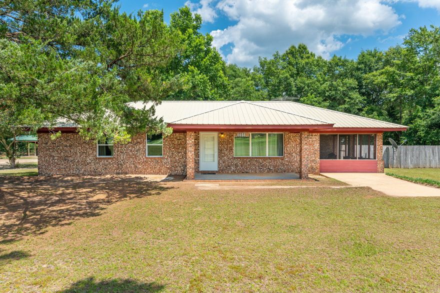 Need to be near Crestview but want a little room? This brick 3 bedroom, 2 bath house sitting on one acre has all the potential to be just what you are looking for! Located North of the Auburn/Garden City area with Laurel Hill school district allows you not only a country feel but the opportunity for a smaller school for your family. Home has a large open kitchen with dining area that welcomes you to a covered patio perfect for afternoon relaxation or to the screened in sunroom. Home has a great living room in the front of the home that is welcoming with a large covered front porch. Home has 3 great size bedrooms along with 2 full baths and a utility room with tons of space for storage. Yard has tons of room for a garden, dog pens and a great workshop! Metal roof and new septic!