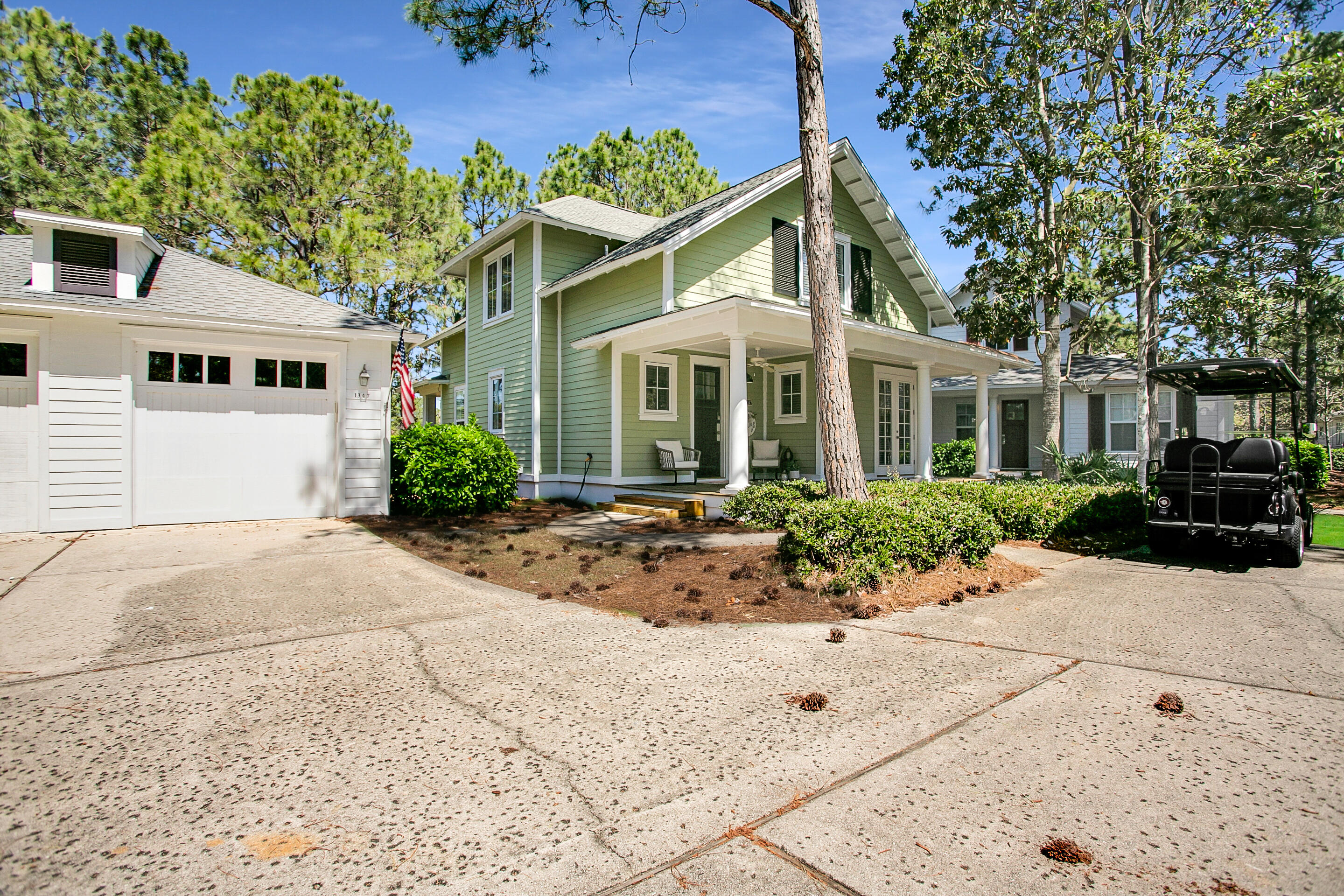 This adorable, newly updated 3 bedroom 3 1/2 bath Laurel Grove cottage with a detached garage is a MUST SEE. The large back porch allows for beautiful views of the #3 green of the Raven Golf Course. Gorgeous pine floors throughout with an open concept kitchen, living, and dining room. Natural light pours through the windows and French doors that surround this space overlooking the lush and peaceful landscape. A first floor master bedroom makes this home even more desirable. Upstairs features a unique floorplan which includes a bunkroom with built-in bunks, twin over queen. This home is freshly painted and includes beautiful all-new furnishings. Just steps from the neighborhood community club house, swimming pool and hot tub.