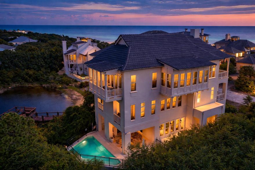 Welcome to an exceptional coastal retreat in the gated, non-rental community of Stallworth Preserve -- 68 Stallworth Blvd. This masterfully designed 3-story home, built in 2021, embodies refined beach living with sweeping views of the white sand beach and emerald green waters of the Gulf. As if Gulf views weren't enough, this gem is located on a coastal dune lake as well. Step inside to discover ~3,908 sq ft of living space highlighted by 5 spacious bedrooms and 7 baths (five full, two half). On the ground level you'll find a welcoming entry, laundry area, a two-car attached garage, and an amazing outdoor living area complete with a summer kitchen and a private pool -- all overlooking the serene coastal dune lake. Upstairs, four bedrooms each come with their own ensuite bath, offering privacy and comfort for residents or guests. The top floor is dedicated to living at its finest: a luminous living room, dining area, and gourmet kitchen all arranged to maximize the stunning Gulf and lake views. Also on this level is an expansive master suite, making this the ultimate retreat space. This home combines beach house charm with modern amenities: double-pane windows, storm-ready doors, ceiling fans, a tankless water heater, and efficient electric systems. Outside, the property sits on an ~8,712 sq ft lot in a private, secluded enclave with direct beach access located just across the driveway. A rare find in this prized 30A neighborhood. Whether you're seeking a luxury retreat, a coastal vacation base, or a high-end investment property, 68 Stallworth Blvd presents a rare opportunity combining privacy, panoramic water views, and turnkey elegance, in a location that offers both serenity and access to the Gulf.
