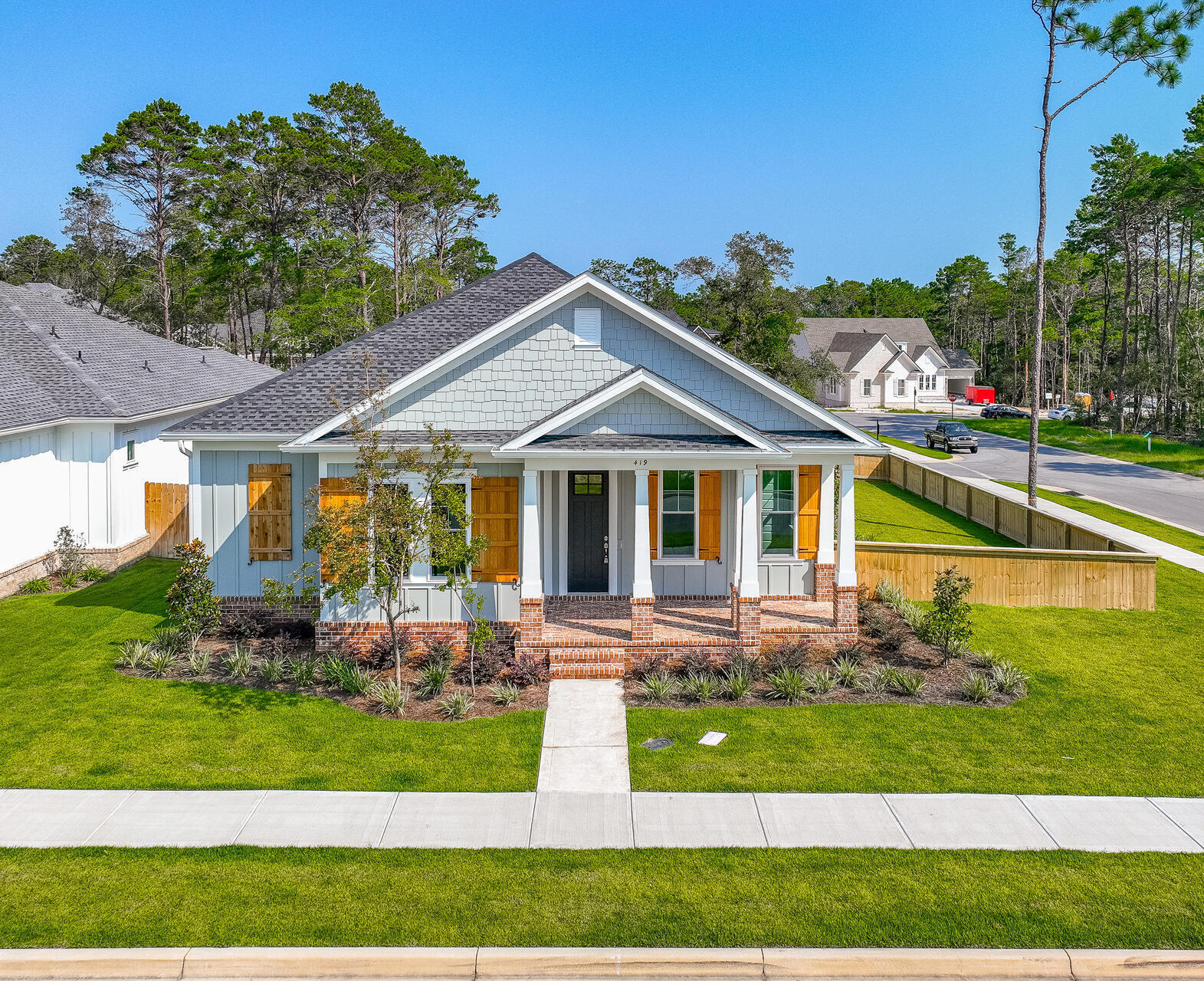Beautiful Craftsman-Style Home on a Large Corner Lot in Deer Moss Creek Phase 2!Welcome to this stunning single-story Craftsman home, ideally located in the highly desirable Deer Moss Creek Phase 2 community. Situated on a spacious corner lot, this home is just steps away from the new clubhouse, resort-style pool, children's playground, half basketball court, gazebo, school bus stop, and scenic walking trails--offering convenience and a vibrant neighborhood lifestyle. Enjoy relaxing on the charming front porch, perfect for your morning coffee or evening wind-down. Inside, this thoughtfully designed home features 4 spacious bedrooms, plus a flex room perfect for an office, playroom, home gym, or even a 5th bedroom. With 3 full bathrooms, an open floor plan, 10' ceilings, and LVP flooring throughout, the home blends style, functionality, and flexibility for modern living.
The heart of the home is a beautifully appointed kitchen, complete with quartz countertops, gas cooktop, custom shiplap hood, wall oven and microwave, and a French door refrigerator, perfect for cooking and entertaining. The primary suite is a true retreat, offering ample space to relax and recharge. It includes an oversized walk-in closet with generous space to accommodate all your wardrobe needs. Enjoy the outdoors from your screened-in side porch, which leads to a fenced side yard, a perfect space for children or pets to play safely. The home also features a deep 27-foot, two-car garage with private access from a rear alley, enhancing both privacy and curb appeal.