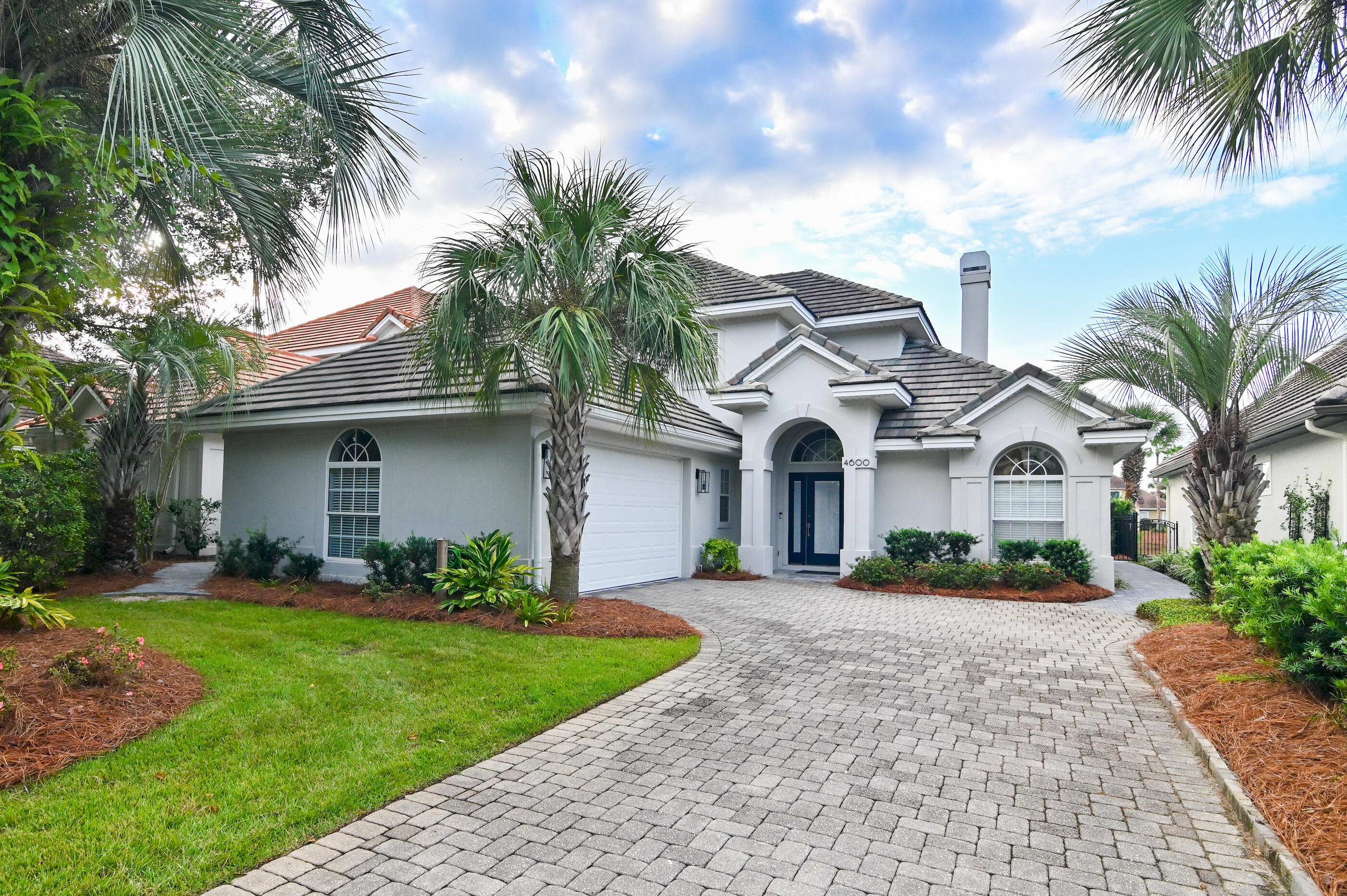 Welcome to 4600 Sailmaker Lane, a beautifully renovated lakefront retreat nestled within the prestigious gated golf community of Regatta Bay in Destin, Florida. This elegant updated 3-bedroom, 2.5-bath home with a 2-car garage offers the perfect blend of comfort, style and modern upgrades -- all set against the serene backdrop of a private lake.Step inside to discover a thoughtfully remodeled interior featuring high-end finishes and custom touches throughout. Click ''more'' to continue. The upgraded master suite is a true sanctuary, boasting a spa-inspired bathroom with a freestanding tub, quartz countertops, custom cabinetry and a sleek Schluter system shower. Solid core doors, Toto toilet and high-end luxury vinyl plank flooring complete the space with sophistication. The master bedroom includes custom window treatments and a custom walk-in closet with wood shelving. The living room impresses with custom wood shelving, LED recessed lighting, shiplap fireplace wall and upgraded sliding glass doors for seamless indoor-outdoor living.
The chef's kitchen is equipped with new top-of-the-line KitchenAid appliances, a new refrigerator compressor and ambient lighting upgrades. The powder room and laundry room have also been fully updated with stylish fixtures and quartz counter tops.
Enjoy Florida's outdoor lifestyle from the newly enhanced lanai, featuring a durable Polyurea floor coating, new screen framing and a relocated door for optimal lake views. The garage has been upgraded with a matching Polyurea floor, refurbished doors and new exterior lighting.
Outside, the home shines with a full exterior repaint using Sherwin-Williams Elastomeric Paint, new gutters, stucco repairs and a professionally designed landscape plan. A brand-new seawall adds 12 feet of usable yard space, complemented by extensive paver installations that flow from the backyard to the front.
This turnkey home is a rare find in Regatta Bay offering luxury, privacy and a lifestyle of leisure just minutes from the beach, shopping and dining.