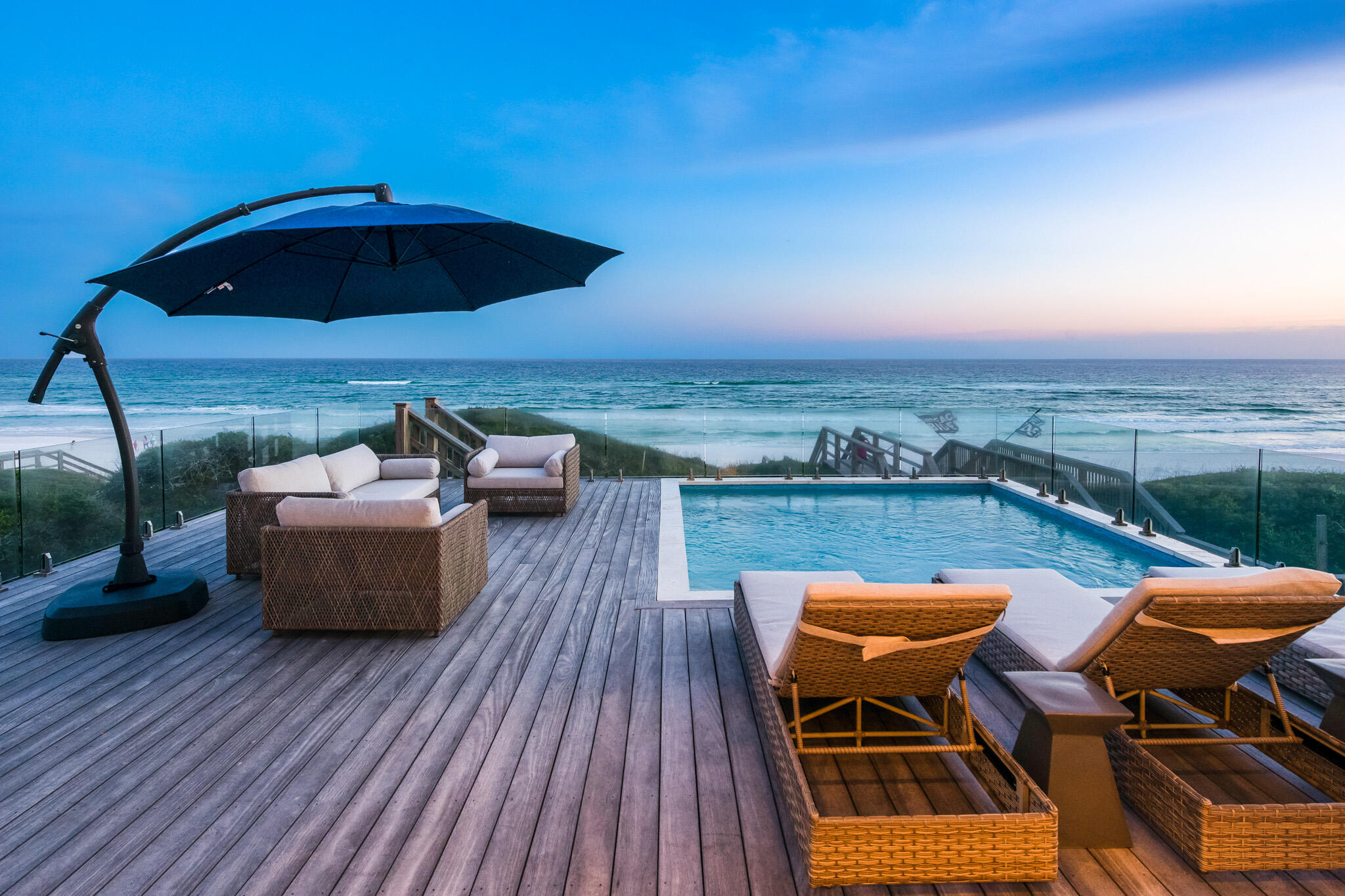 4895 W County Hwy is an exceptional Gulf front home, built in 2020, that exemplifies true luxury. This substantial 30A residence is a turnkey, move-in ready oasis sitting on a .39-acre lot with FOREVER GULF VIEWS. Boasting six bedrooms and seven bathrooms for a total of 6,751 square feet. It is three stories tall and equipped with an elevator. The superb design and style of this home is evident by Stackable Mracek's approach. Achieving a special balance of contemporary and elegant features, thoughtfully curated with an extreme attention to detail. There is a natural and relaxed flow to the home along with large windows and doors, vaulted ceilings and stunning finishes including Quartz, whitewashed ceilings, top of the line fixtures and unique lighting throughout.