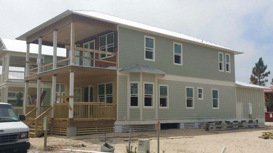 Our very first new 2 car garage home! This gorgeous Sea Breeze home will be completed in July! This is a hard to find price on a 2 car garage new home South of Highway 98! Across a welcoming wooden bridge, nestled amongst preserves, winding trails, and boardwalks, you will discover NatureWalk at Seagrove. This ultimate walkabout community has a prime location near 30A in addition to providing residents with the amenity-rich Gathering Place- complete with heated lap pool, hot tub, zero entry pool, firepit, grills, and much more! Newly added amenities will include more trails throughout, Energi fitness stations, multi-purpose court, pickelball court, and more green space. NatureWalk has a seasonal beach shuttle running to and from the beach and Seaside! This Sea Breeze plan has 2 huge covered porches to sit and relax or socialize with neighbors.  Step into the home through double glass doors to an open living/ dining/ kitchen area with soaring 10 ft ceilings. Kitchen will come complete with GE Caf???? appliance package (GE monogram hood) including gas cooktop, white subway tile backsplash, Schrock quality white cabinets, with soft close drawers.  This home has generously sized 1st floor suite, owner's suite upstairs with huge closet, an additional bedroom, bunk room (could be small 4th bedroom) and loft!  Wood floors throughout the whole house, outdoor showers, impact resistant windows/ doors, and 2 x 6 exterior framing are just a few of the things we do differently than other area builders. Stop in to see our 3 decorated model homes today!  We are open 7 days a week!